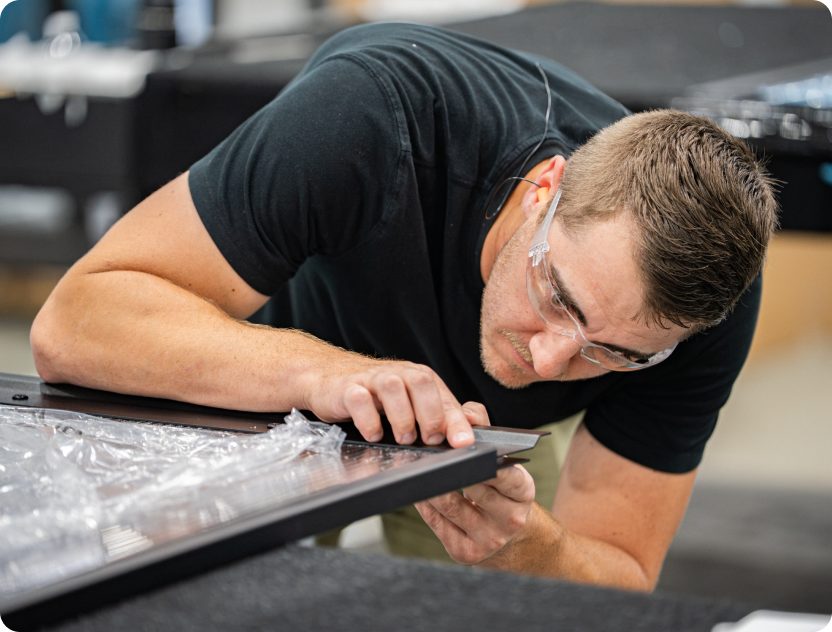 Accelevation technician inspecting a manufactured power assembly