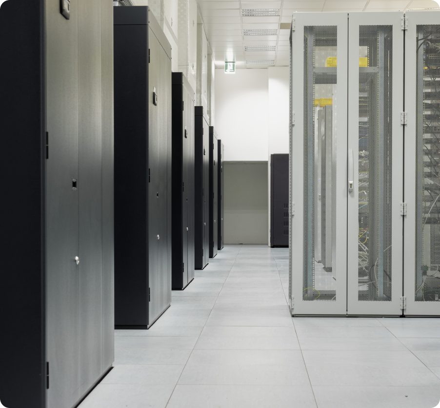 Data hall aisle lined with seismically isolated equipment cabinets.