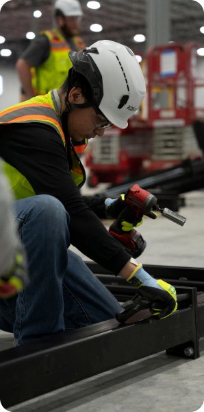 Crew assembling a rack frame in the factory