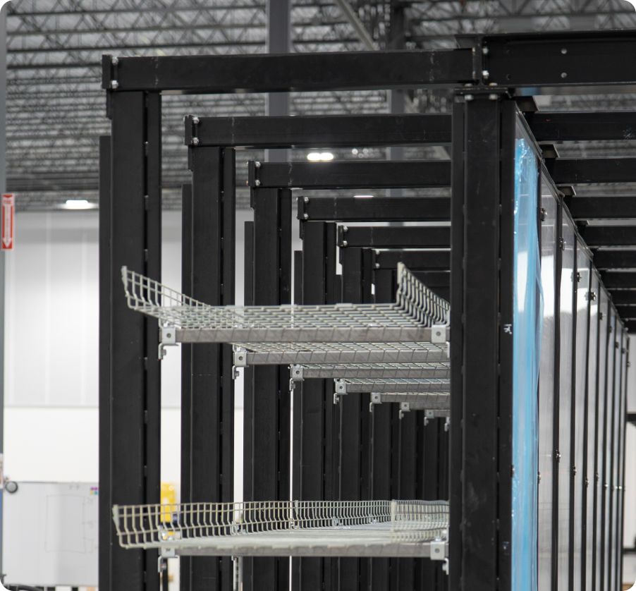 Structural rack framing with overhead cable tray
