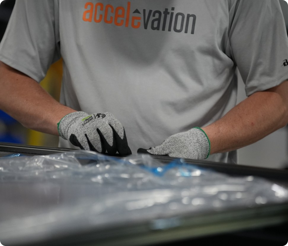 An Accelevation employee inspecting a fabricated assembly