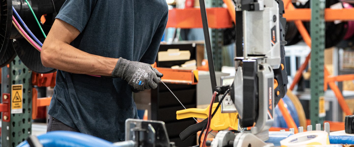 Accelevation team member assembling wiring in the manufacturing facility