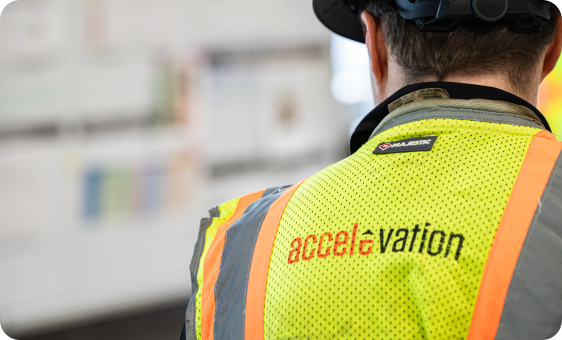 Accelevation team member wearing a high-visibility safety vest
