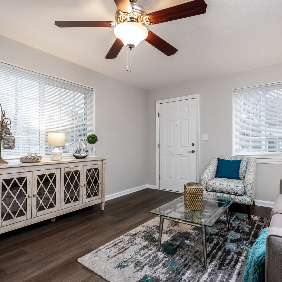 Living room with multiple windows and couch