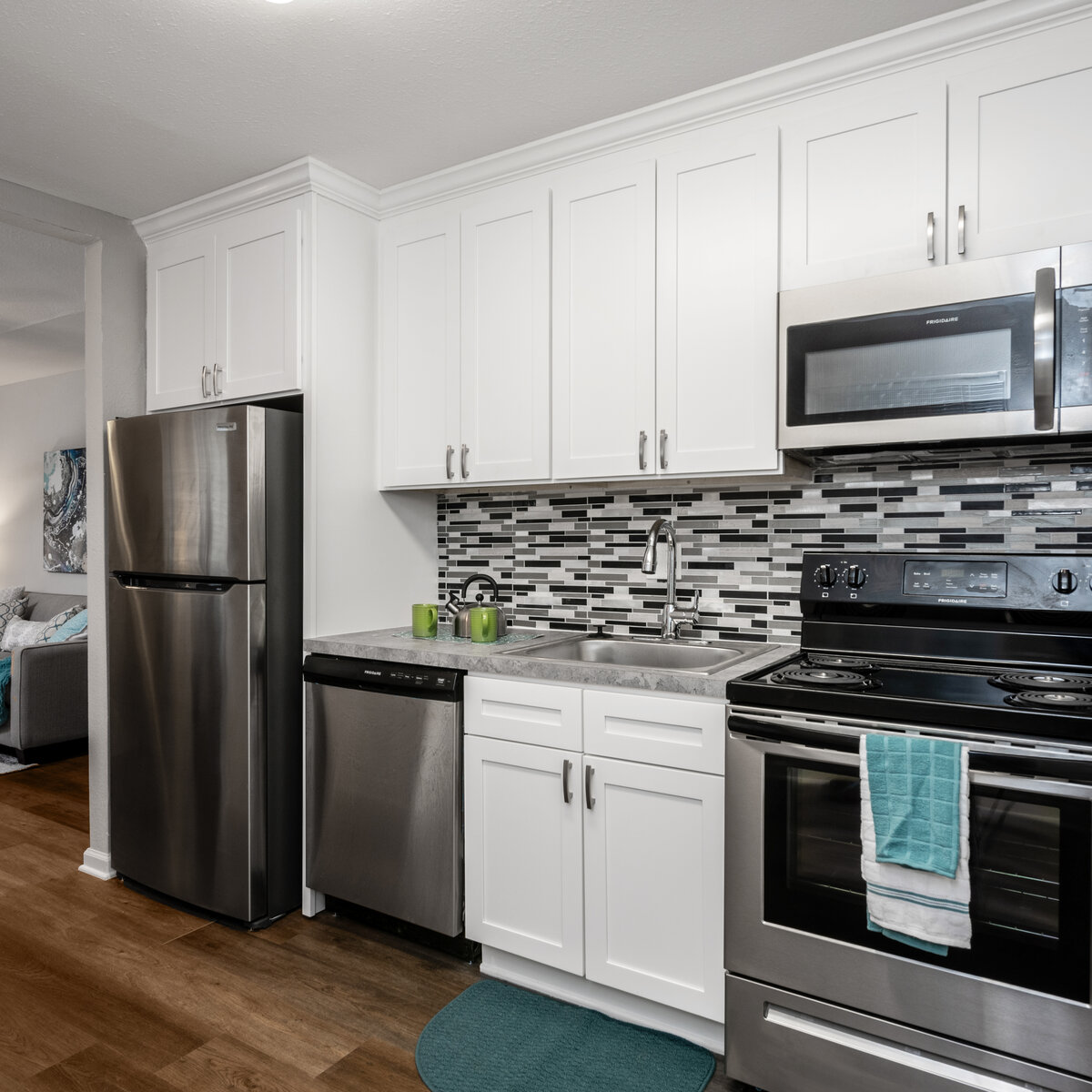 Kitchen with white cabinets and stainless steal appliances