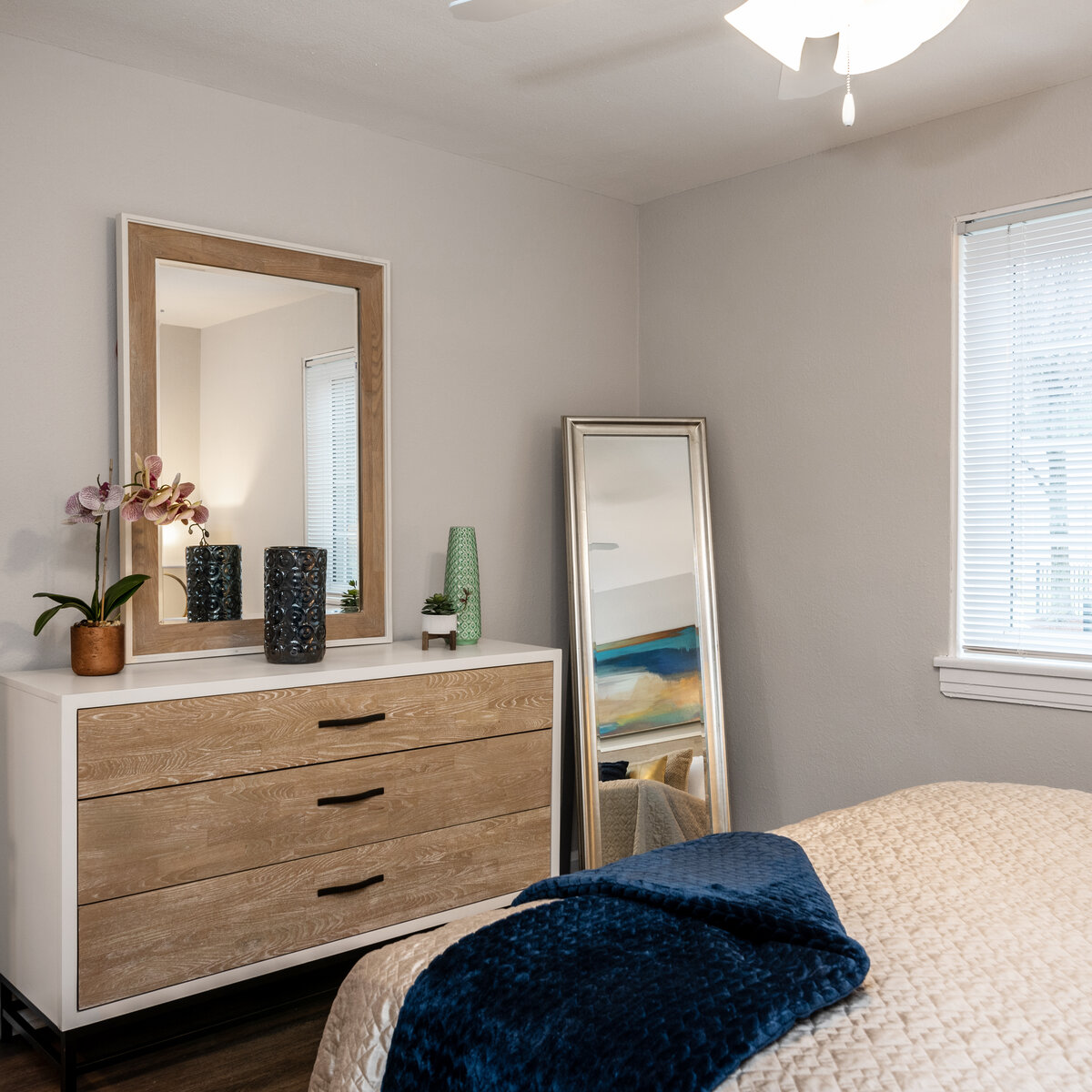 well lit Bedroom with dresser