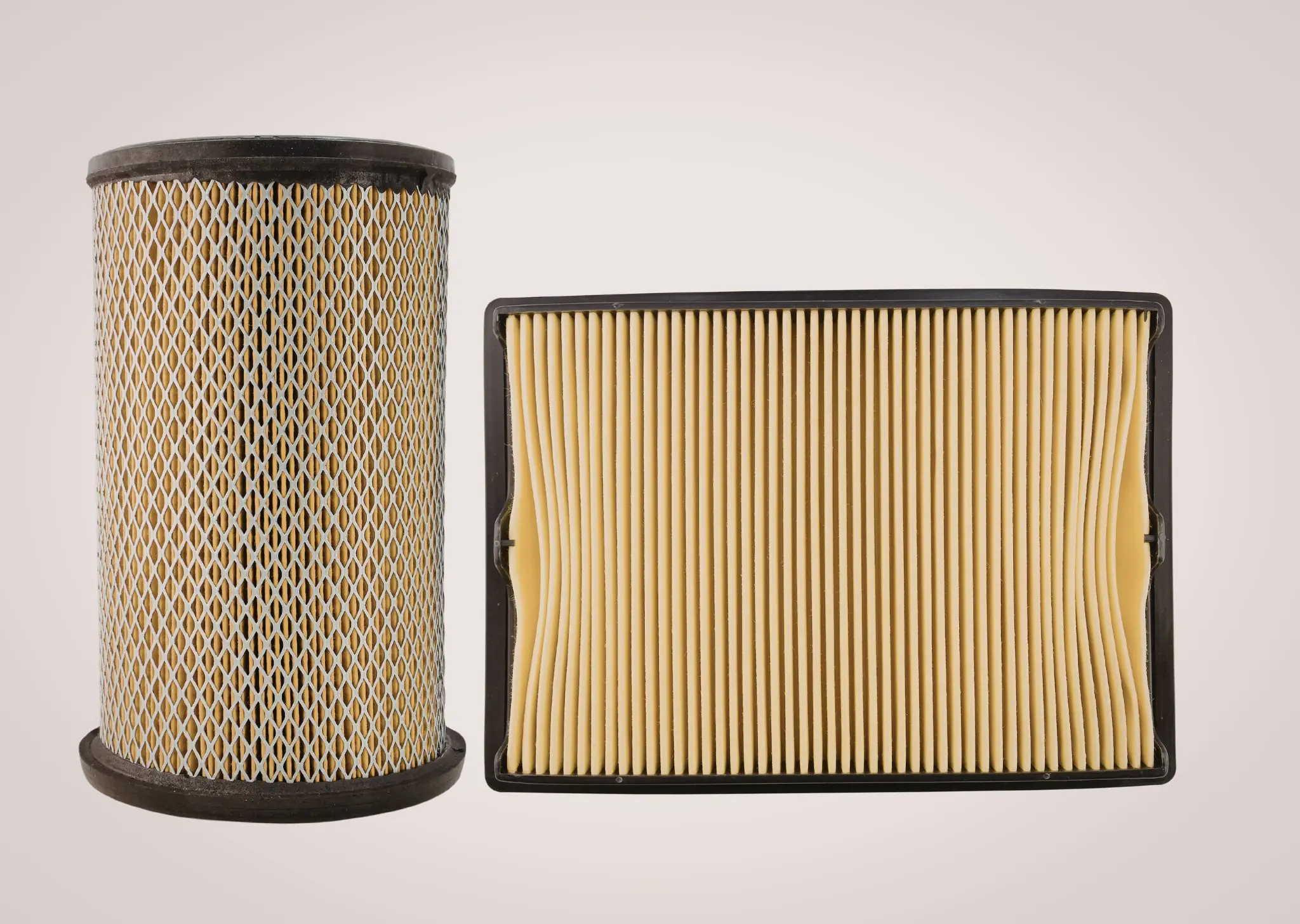 Two beige air filters with black rims on a light background, one cylindrical and one rectangular.