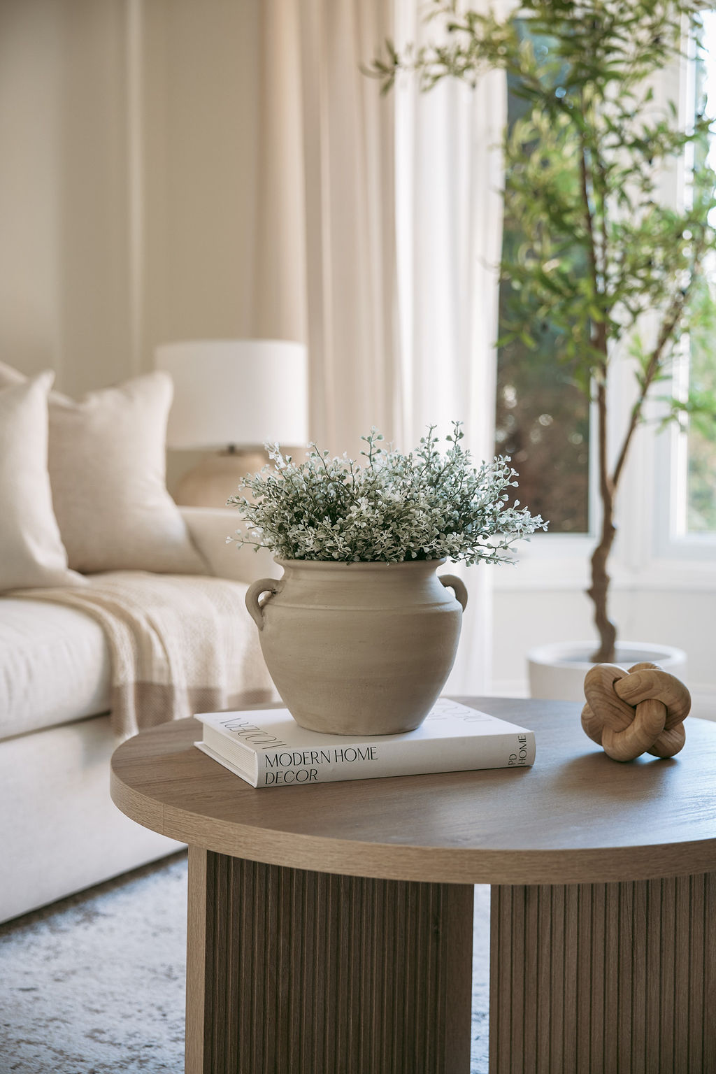 Rattan chair by a window with indoor plant