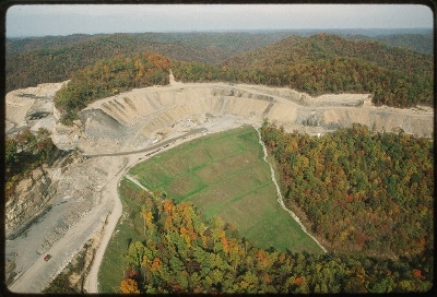 Former cove on Cabin Creek (inverted green chevron, center) stuffed with mine waste and hydroseeded with non-native grasses. Tending the Commons photo by Lyntha Eiler, Courtesy, American Folklife Center, Library of Congress. 