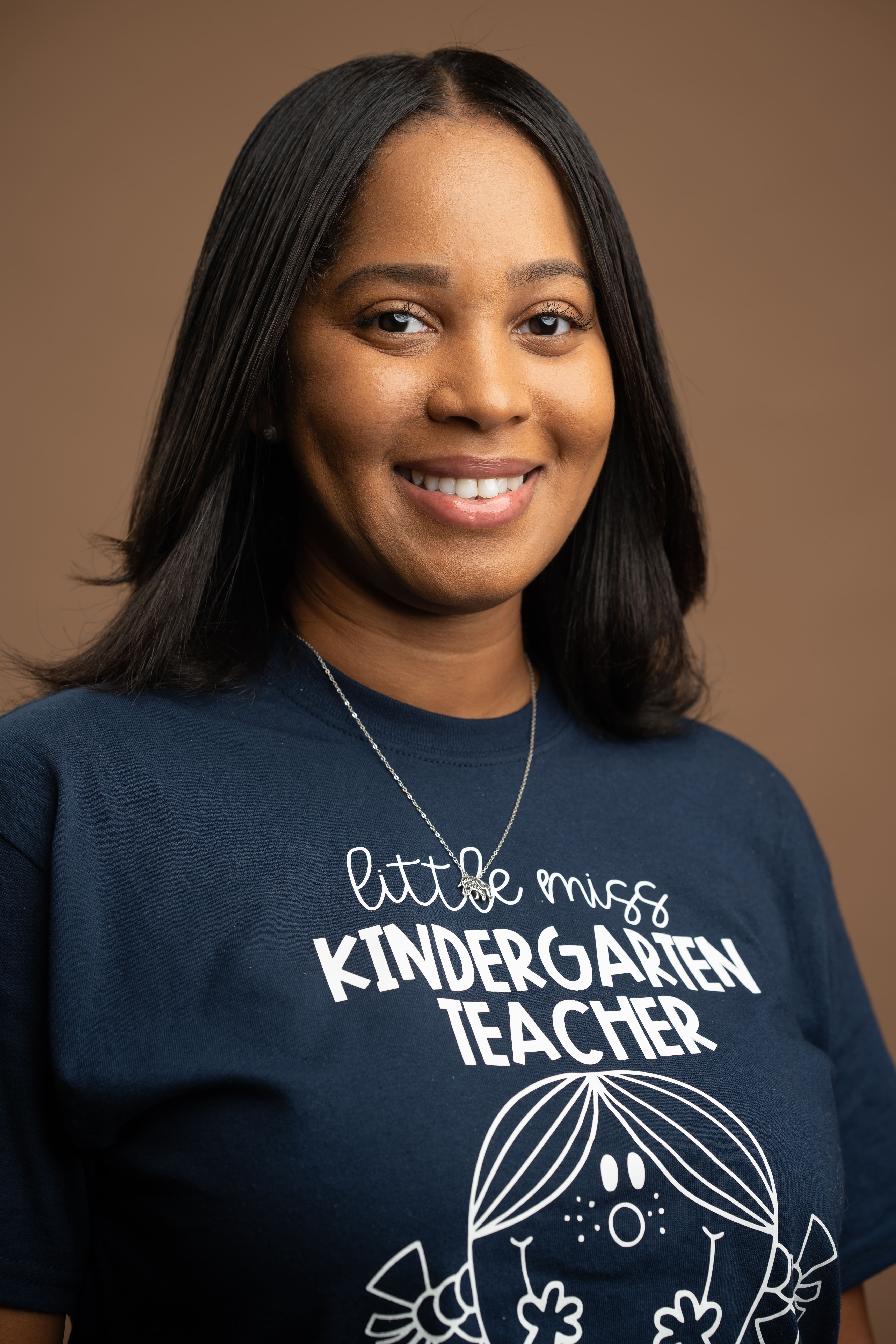 Kindergarten teacher B. Robinson smiling in staff portrait photo