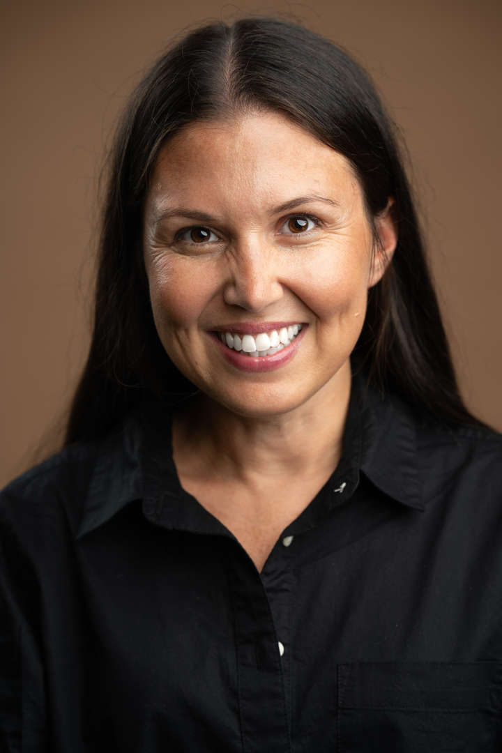 Ms. Settanni smiling in a professional staff headshot