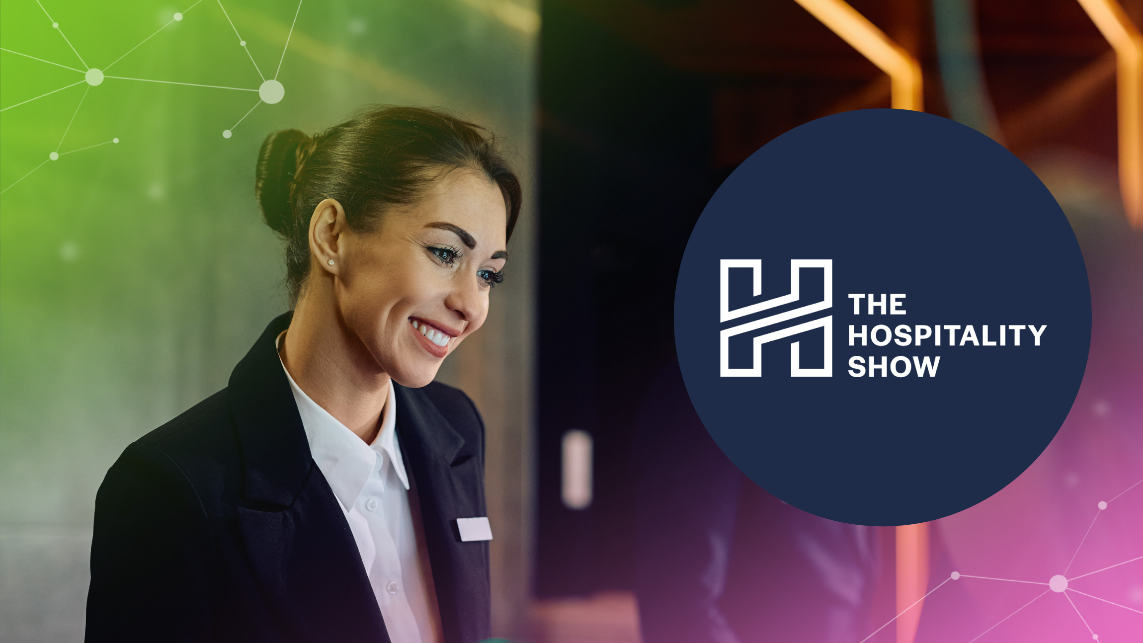 Smiling woman in hospitality uniform beside The Hospitality Show logo in a professional setting.