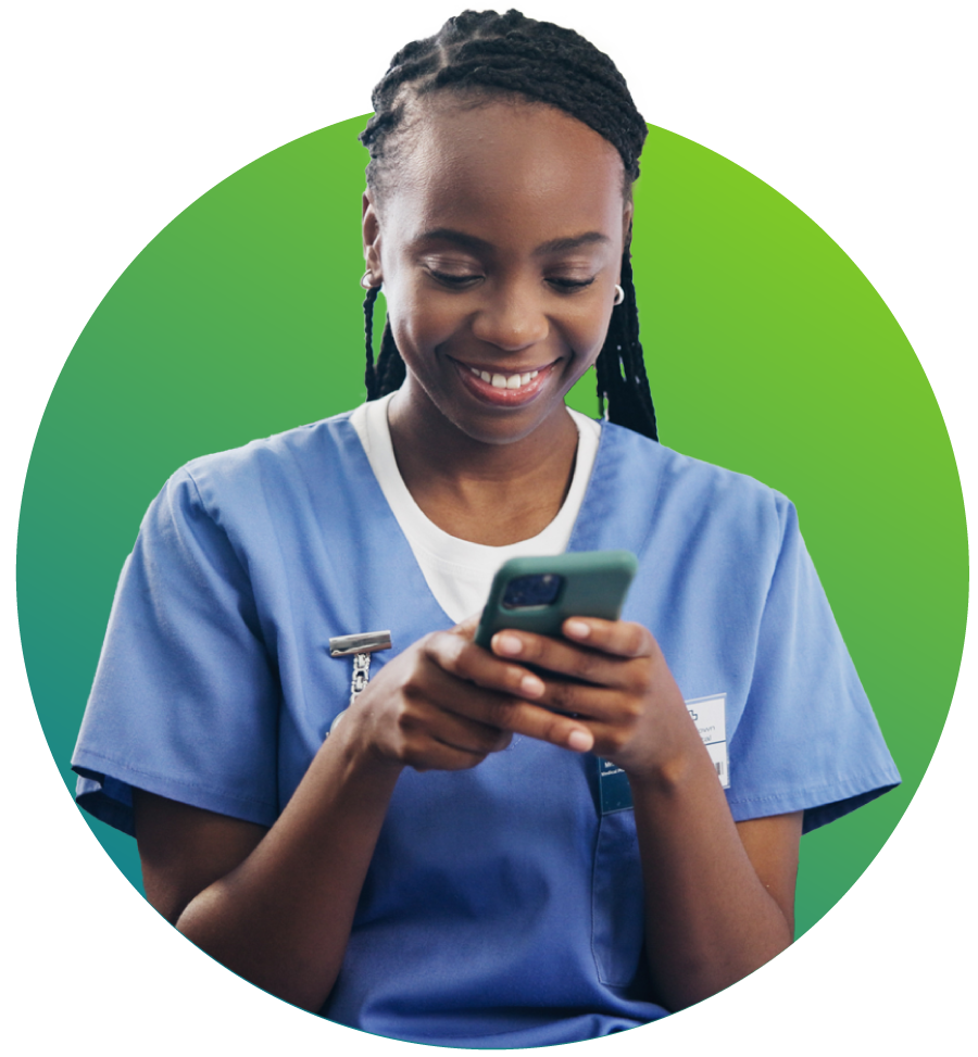 Smiling nurse in blue scrubs looking at a smartphone in front of a green circular background.