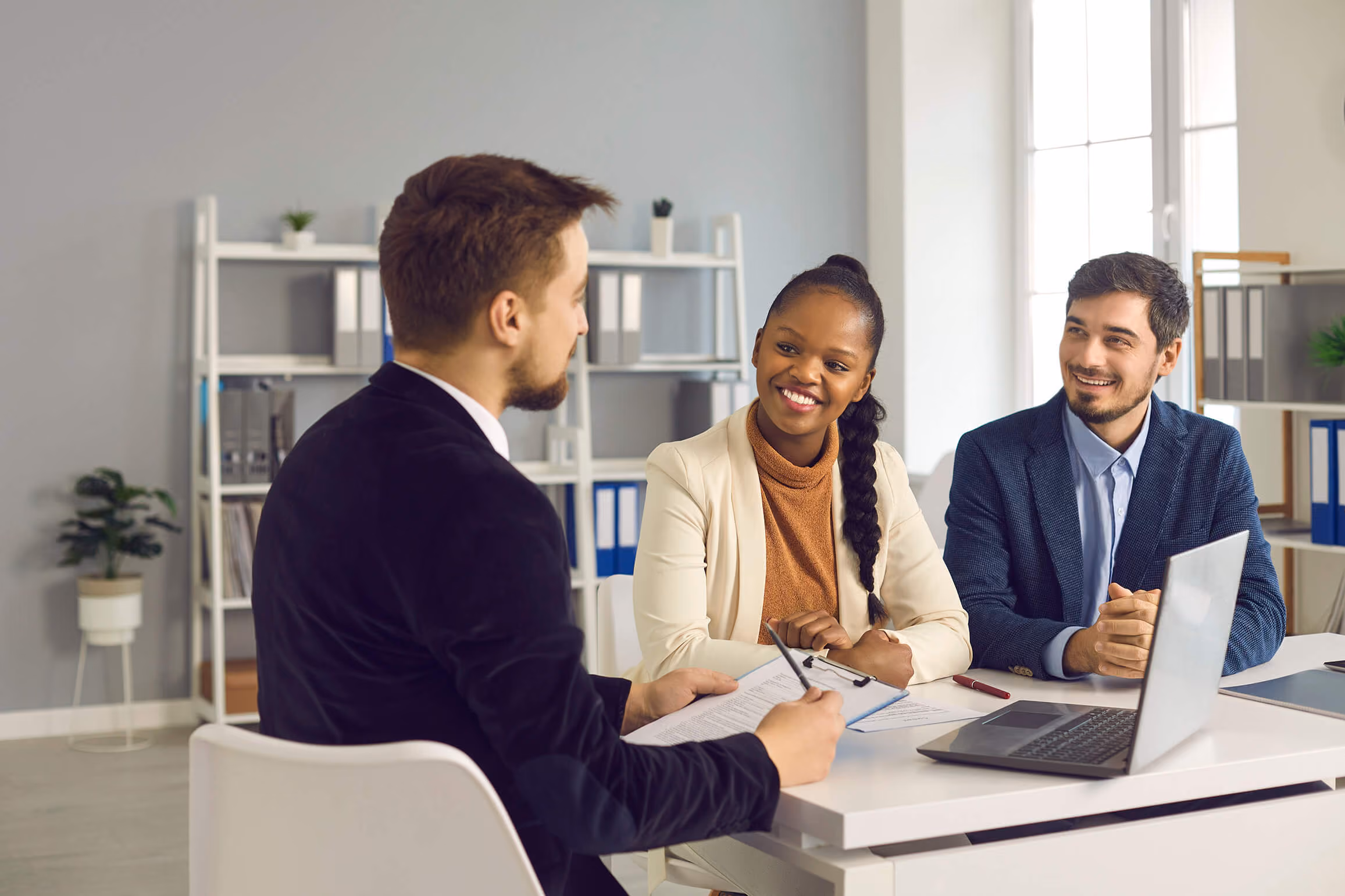 An investment advisor discussing financial plans with his clients