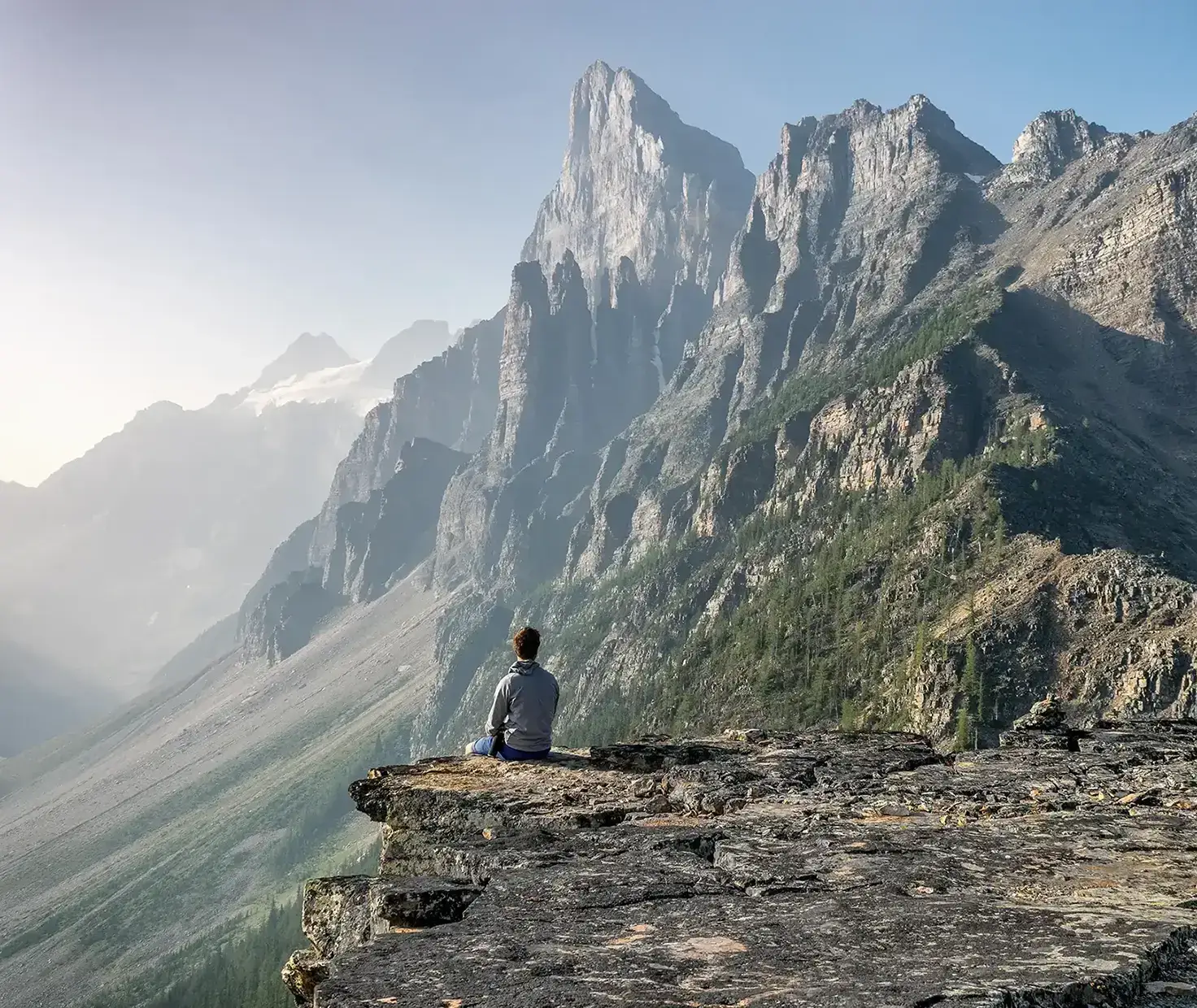 Man sitting on mountain top