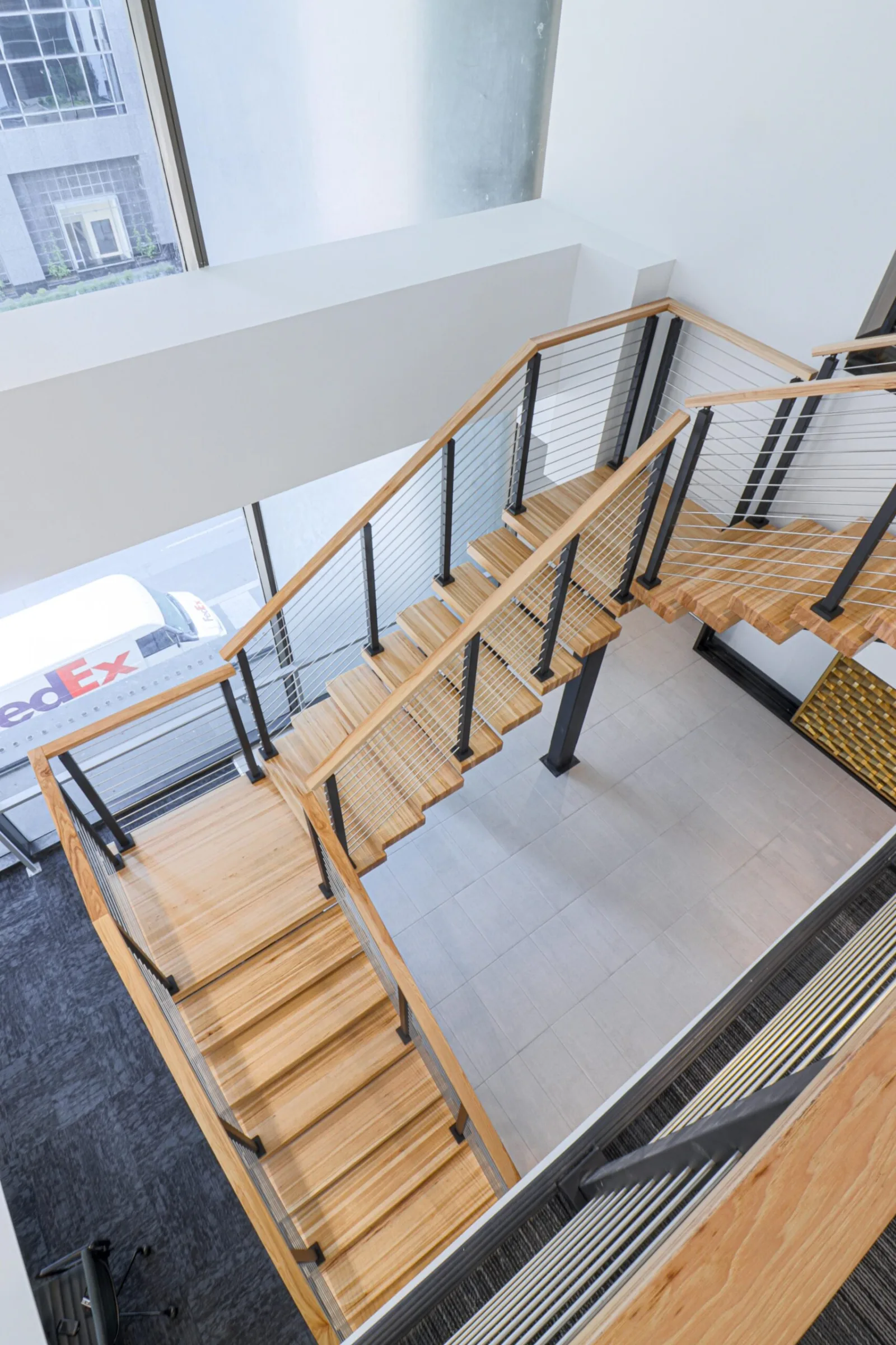 Looking straight down on the switchback landing and open-riser treads