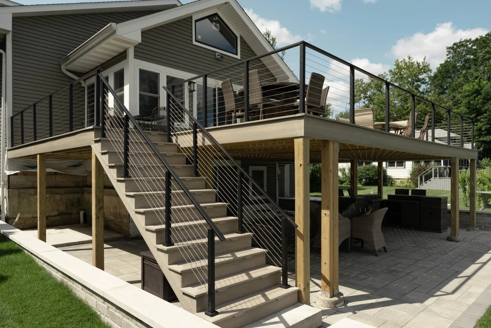 Angled view of the deck, its stair run and the railing above