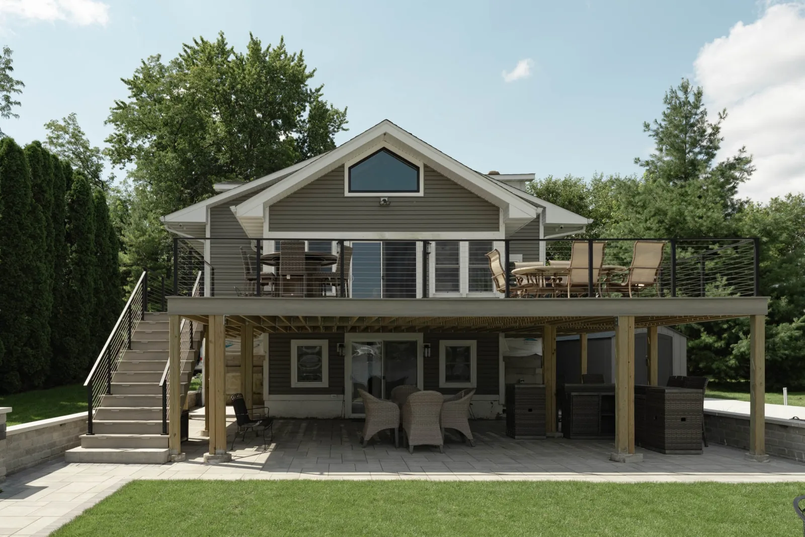 Rear elevation of the house showing the full deck railing run