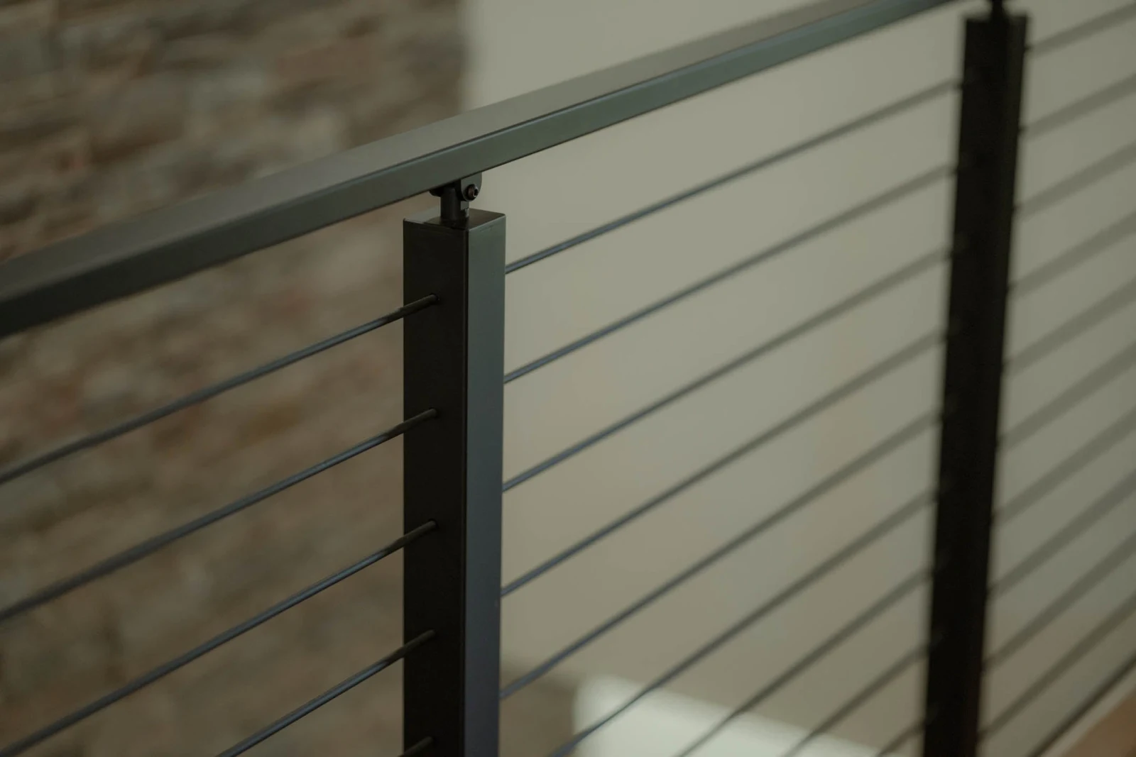 Two posts and a flat top rail carry evenly spaced rods across the run