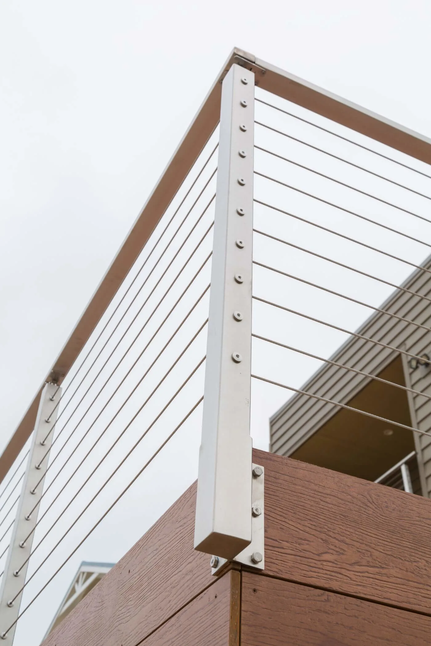 Looking up at a stainless post side-mounted to the deck fascia