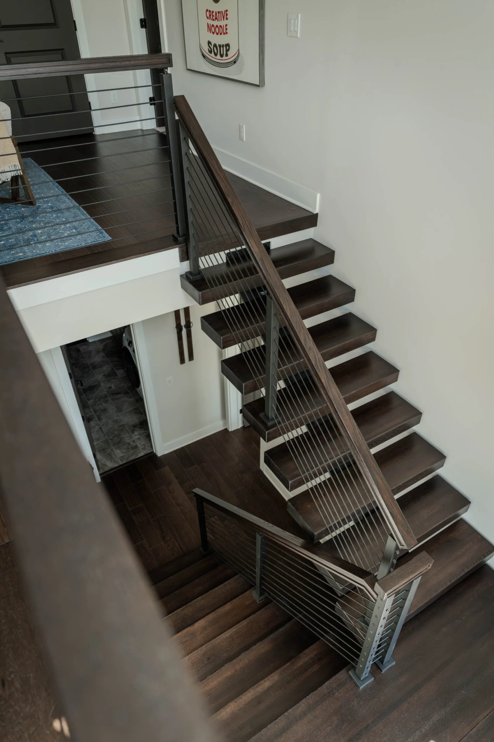 Overhead view down the switchback flight, open risers and taut horizontal rods