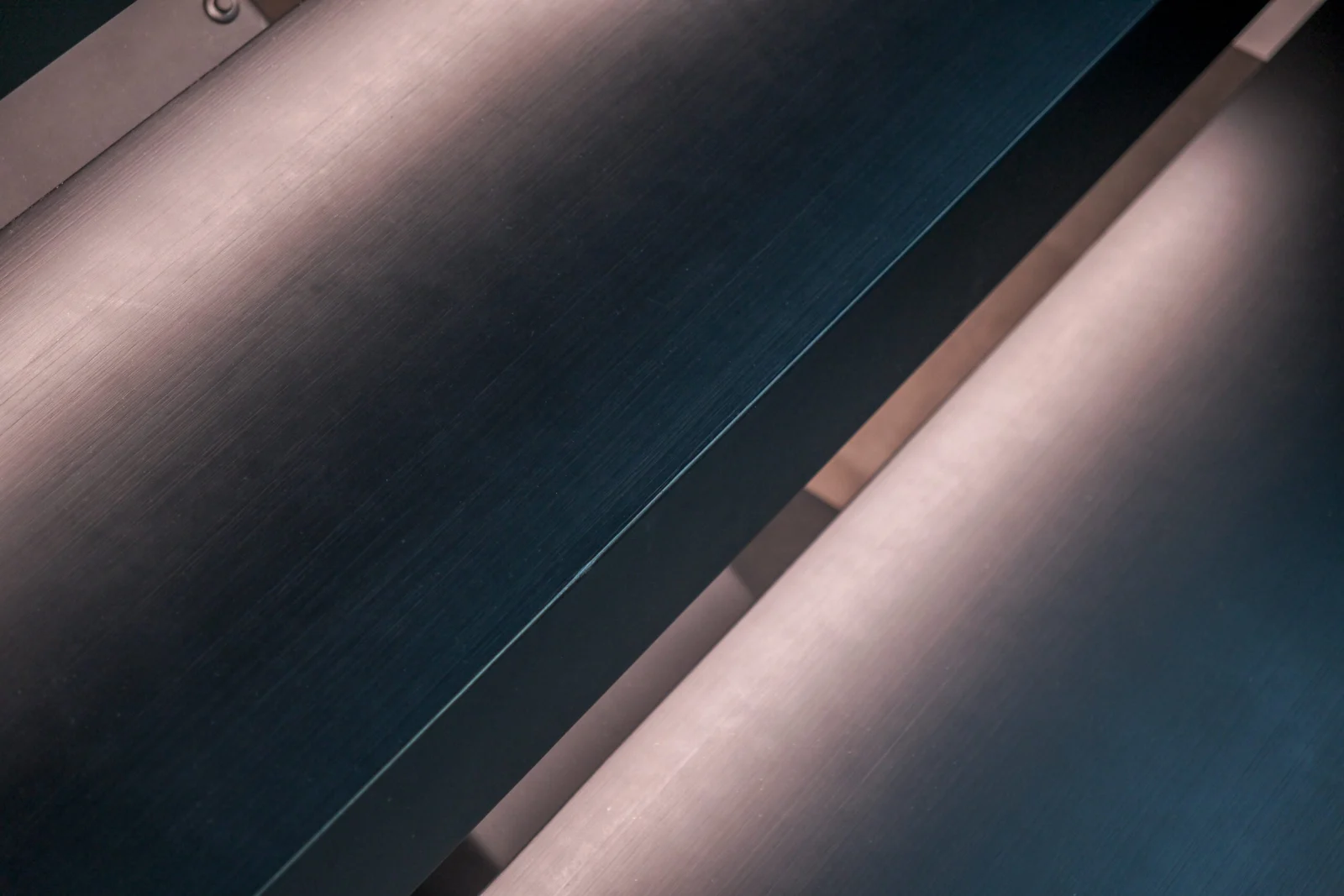 Abstract close view of glowing tread edges and the dark stringer