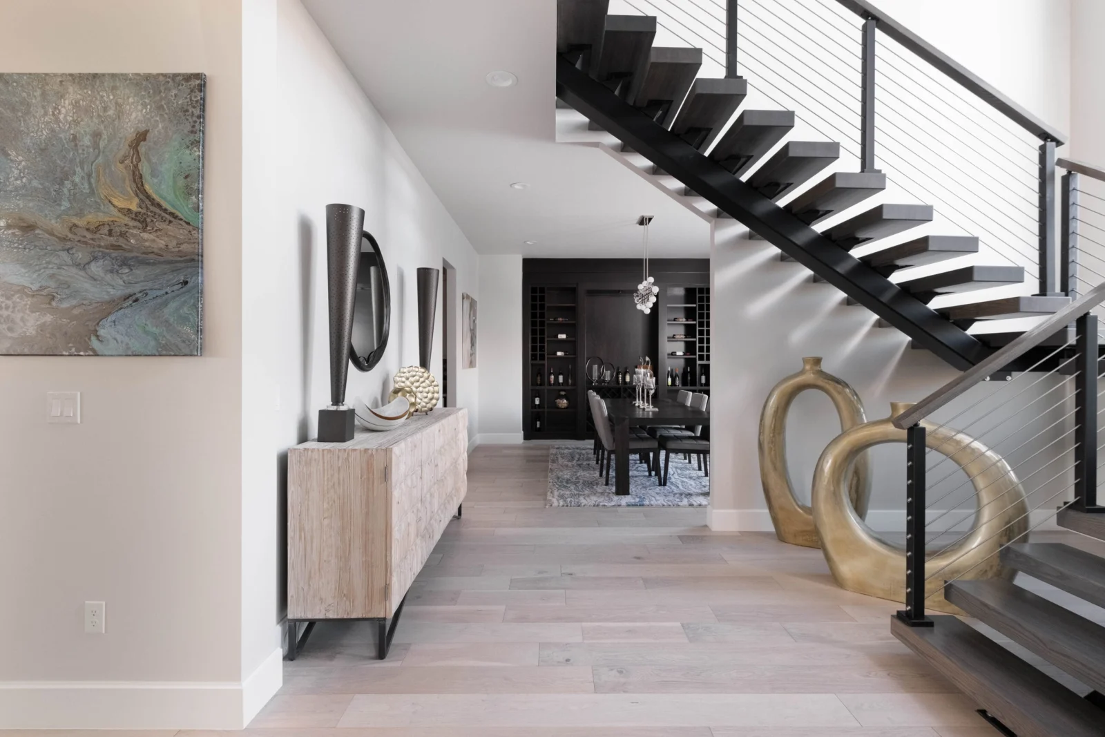 Hallway beneath the cantilevered treads looking through to the dining room