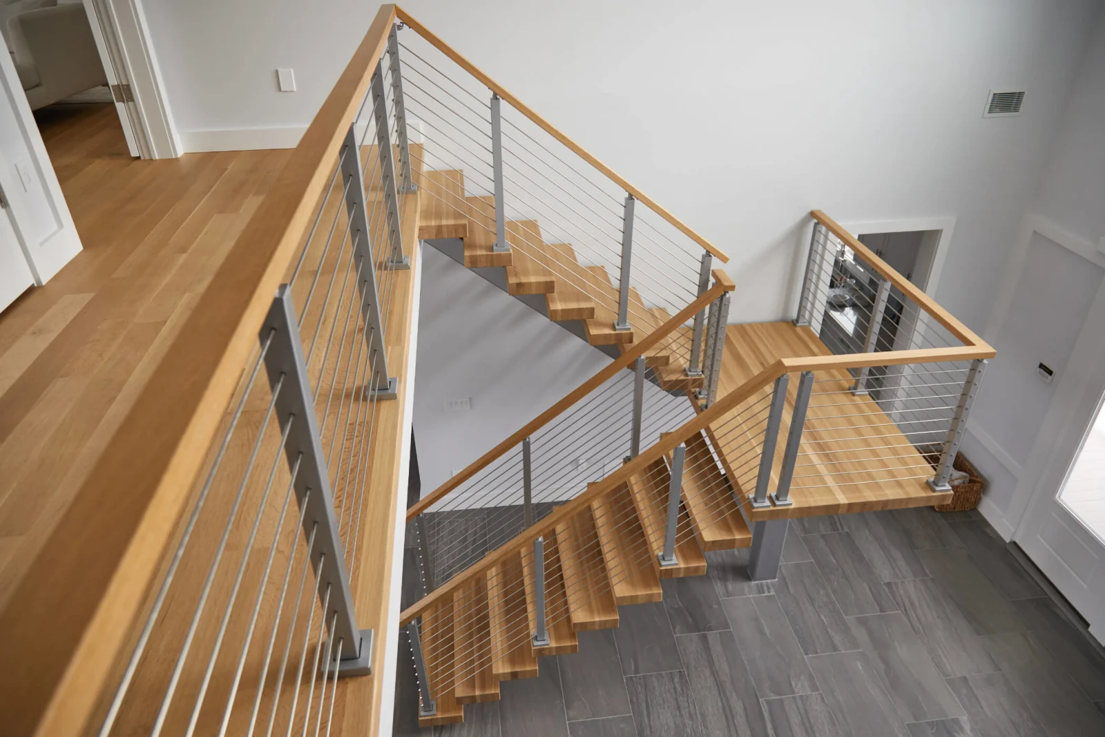 Overhead view of the switchback with railing on both sides of the landing