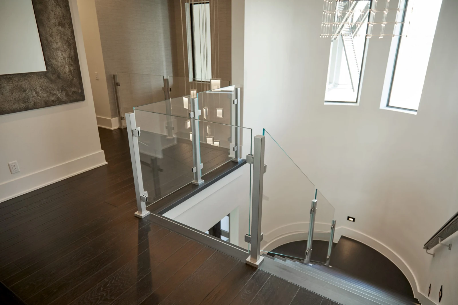 Overlook with glass panels around the curved stair opening