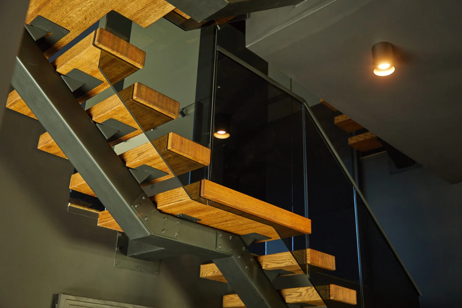 Underside of the stair showing tread ends carried by the steel stringer