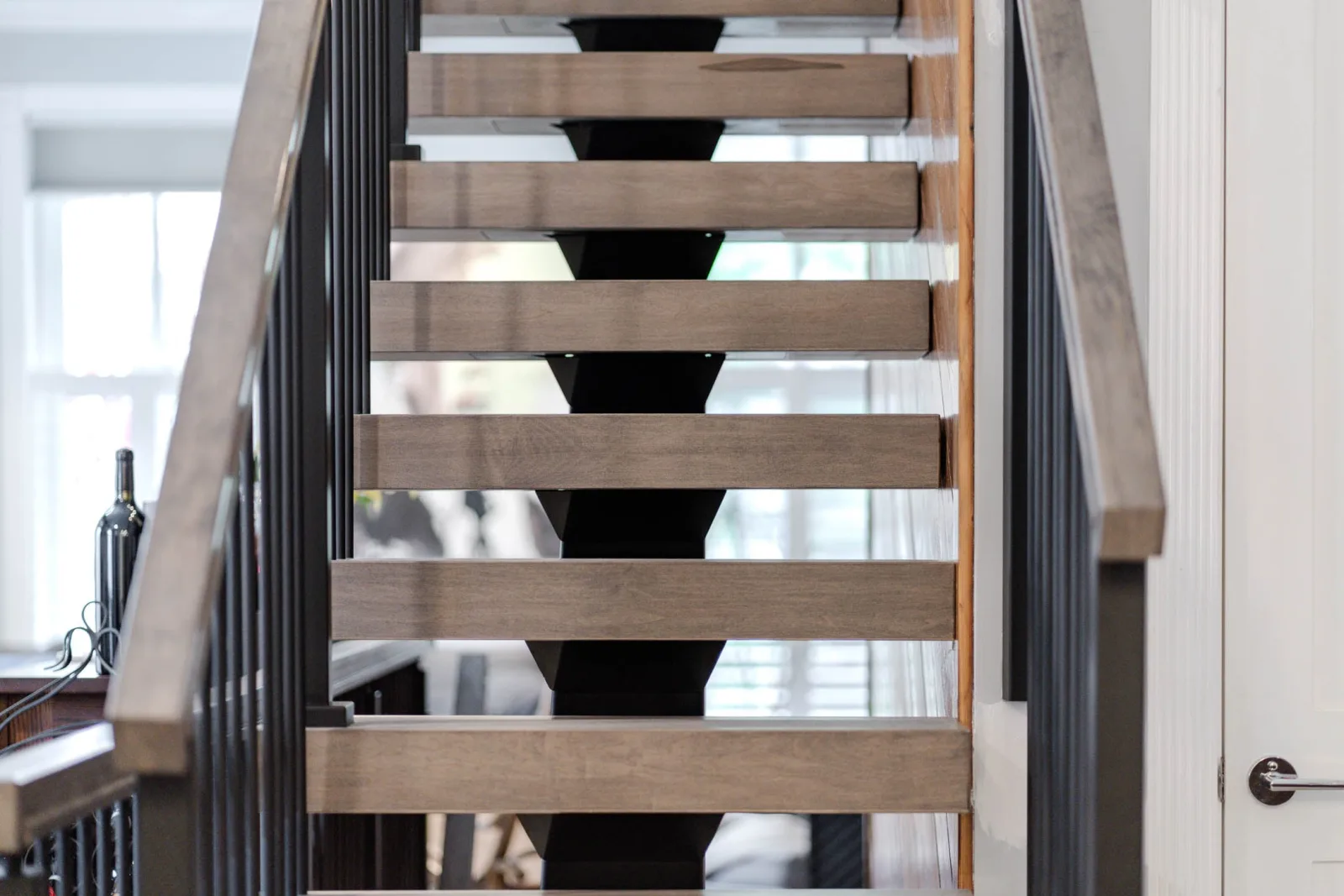 Head-on view of the open risers framed by vertical rod railing