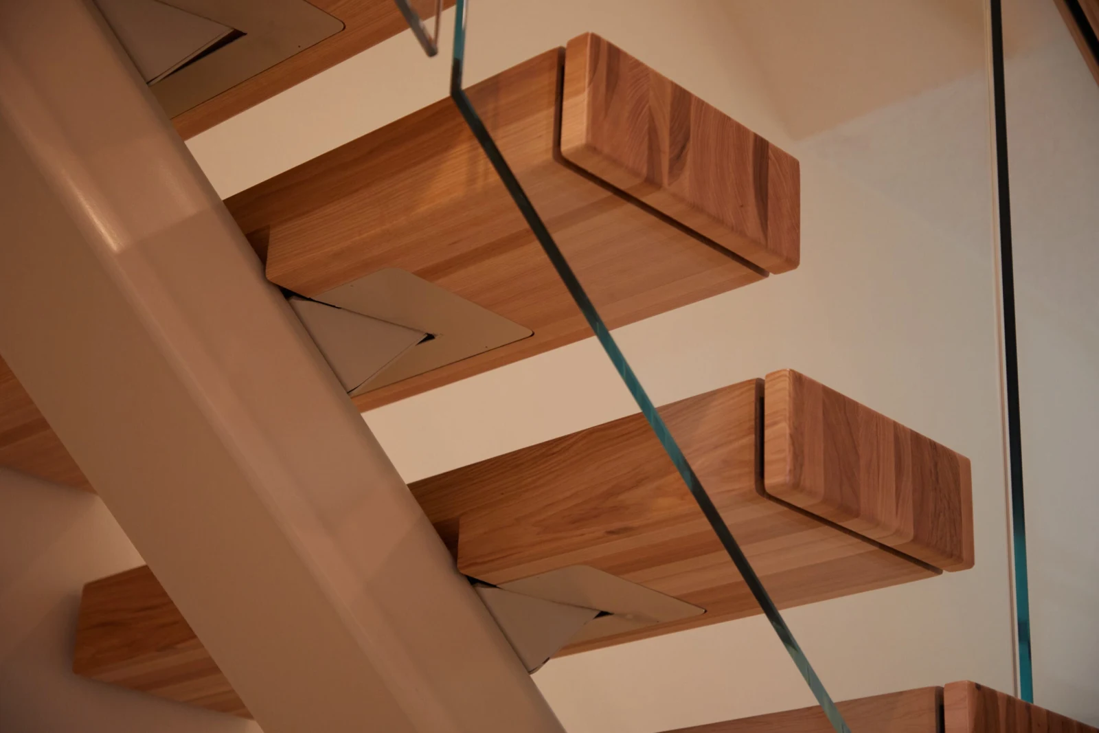 Tread brackets and stringer detail seen from directly underneath the stair