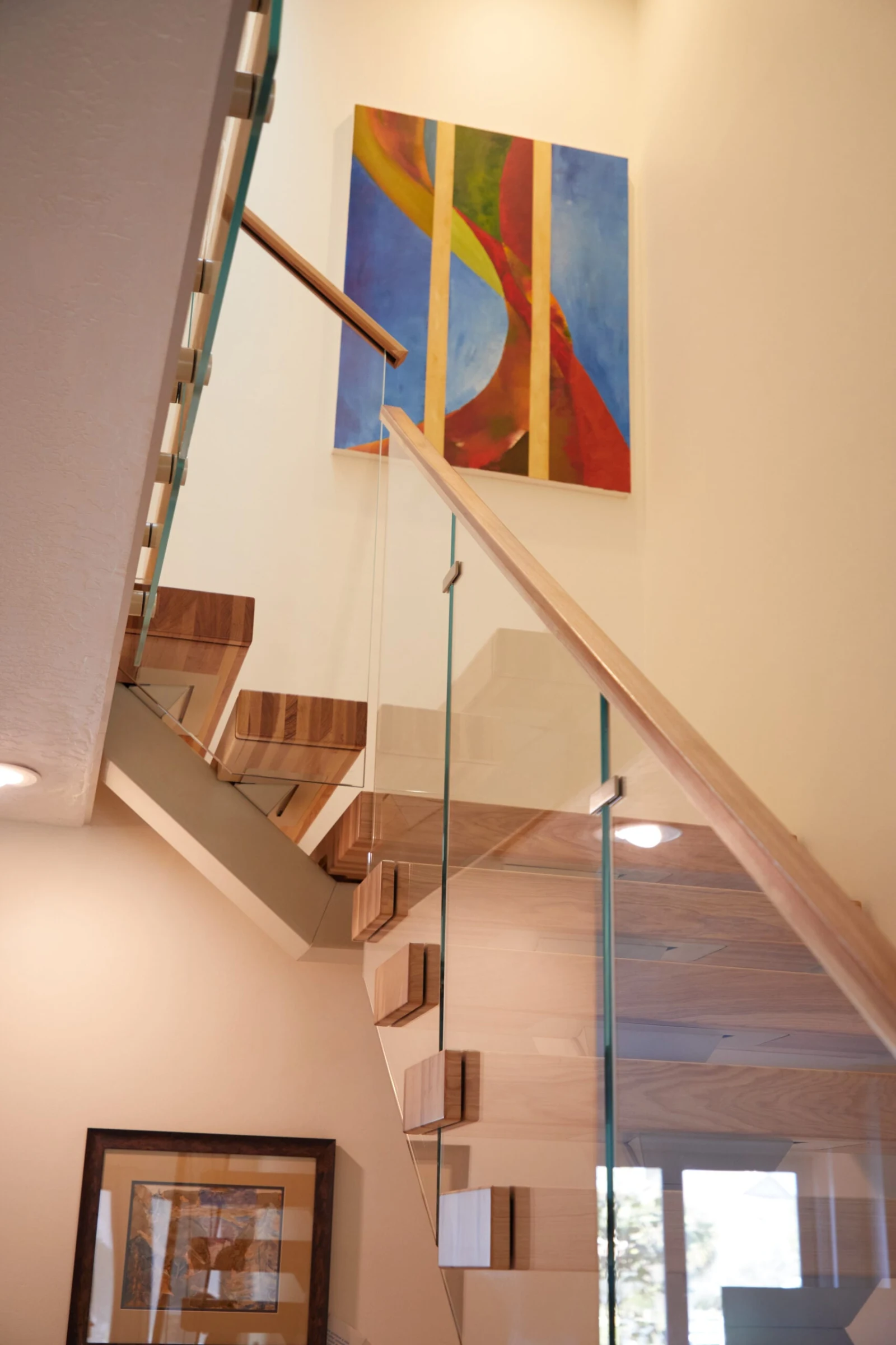 Upper flight and landing rail framed against a tall painted wall