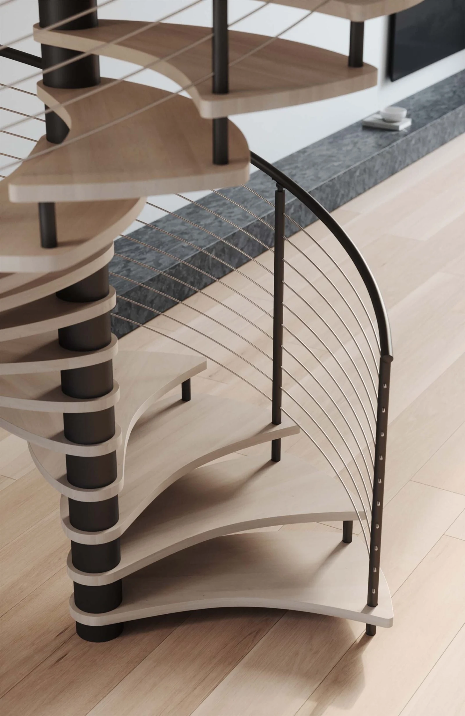 Base of a spiral stair with pale treads and a curved cable infill railing