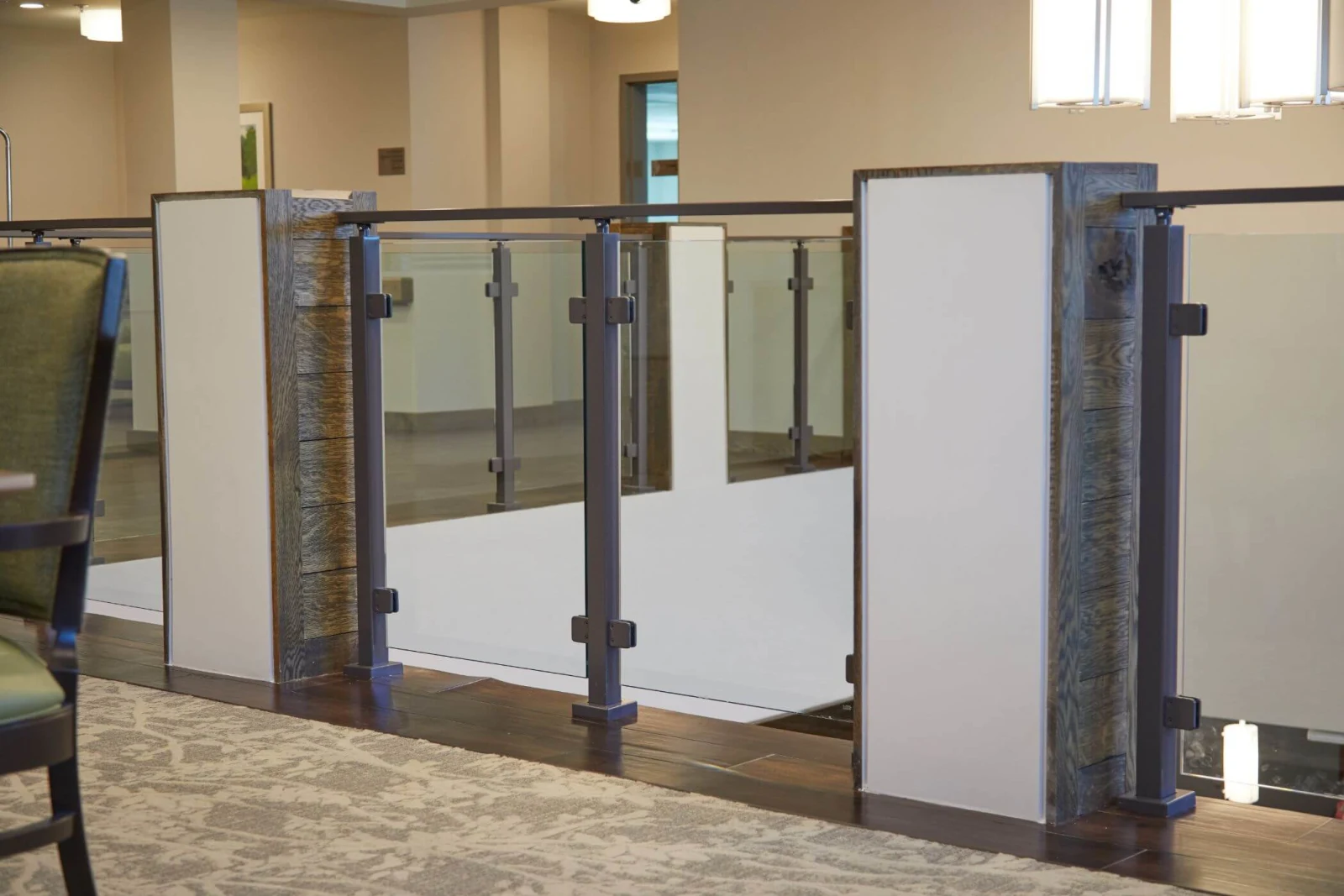 Row of railing bays between columns seen straight on from a dining room