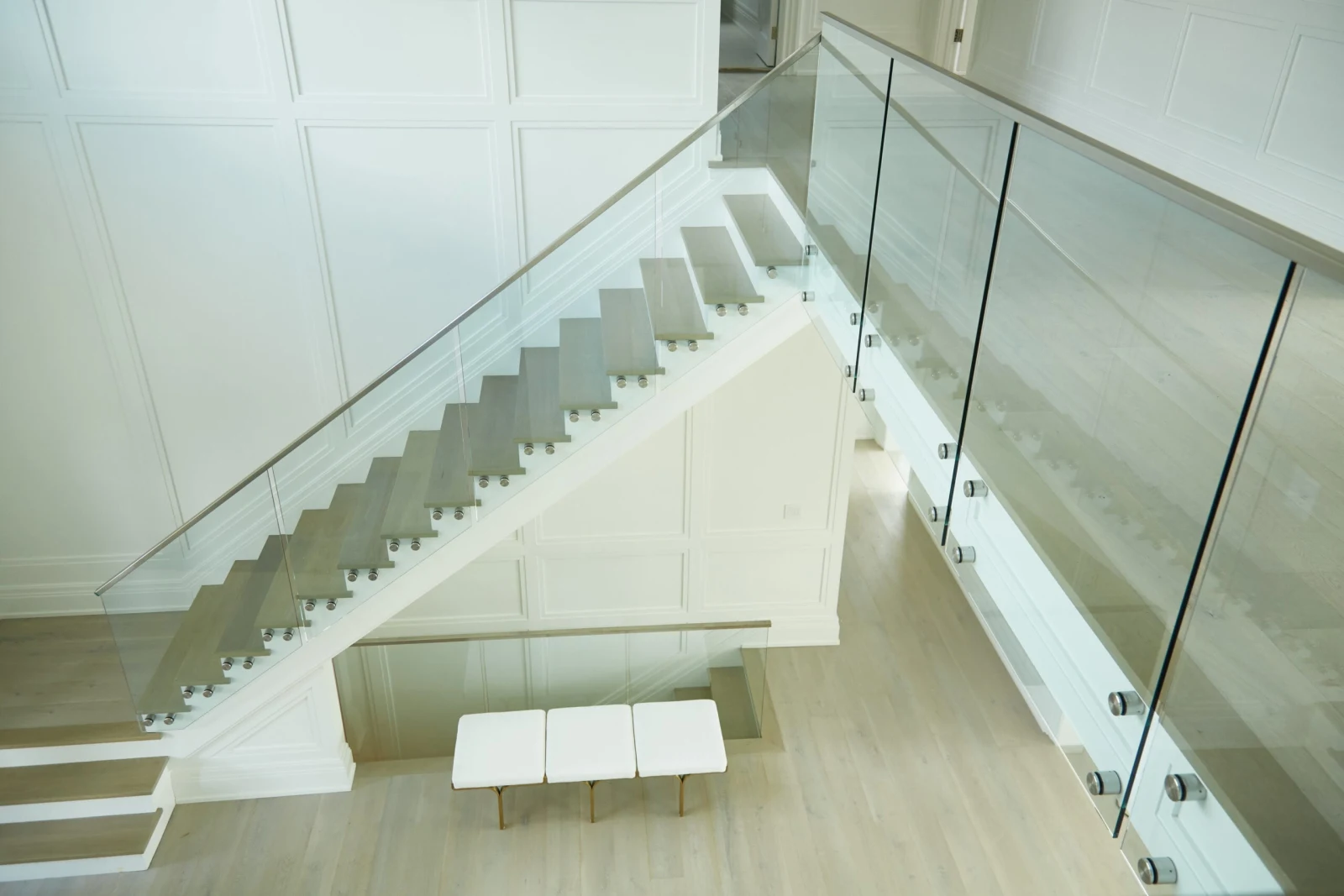 Elevated view of the stair and landing wrapped in frameless glass