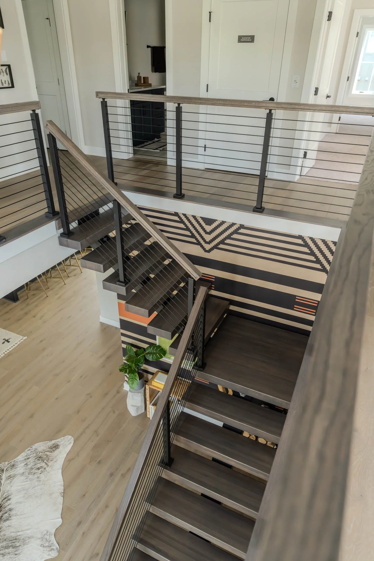 Overhead view of the stairwell with railing runs on three sides