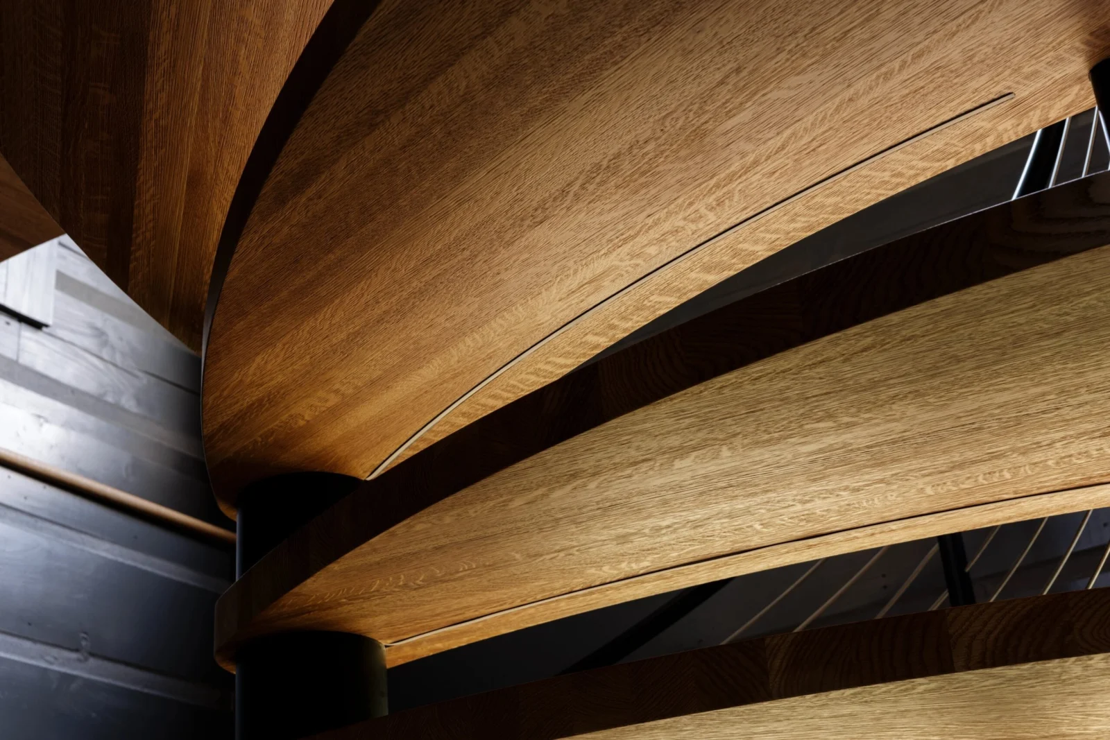 Close view of stacked curving treads lit from below