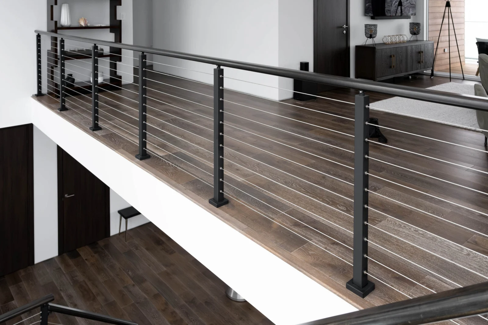 Long balcony run of cable railing above the lower-level living space