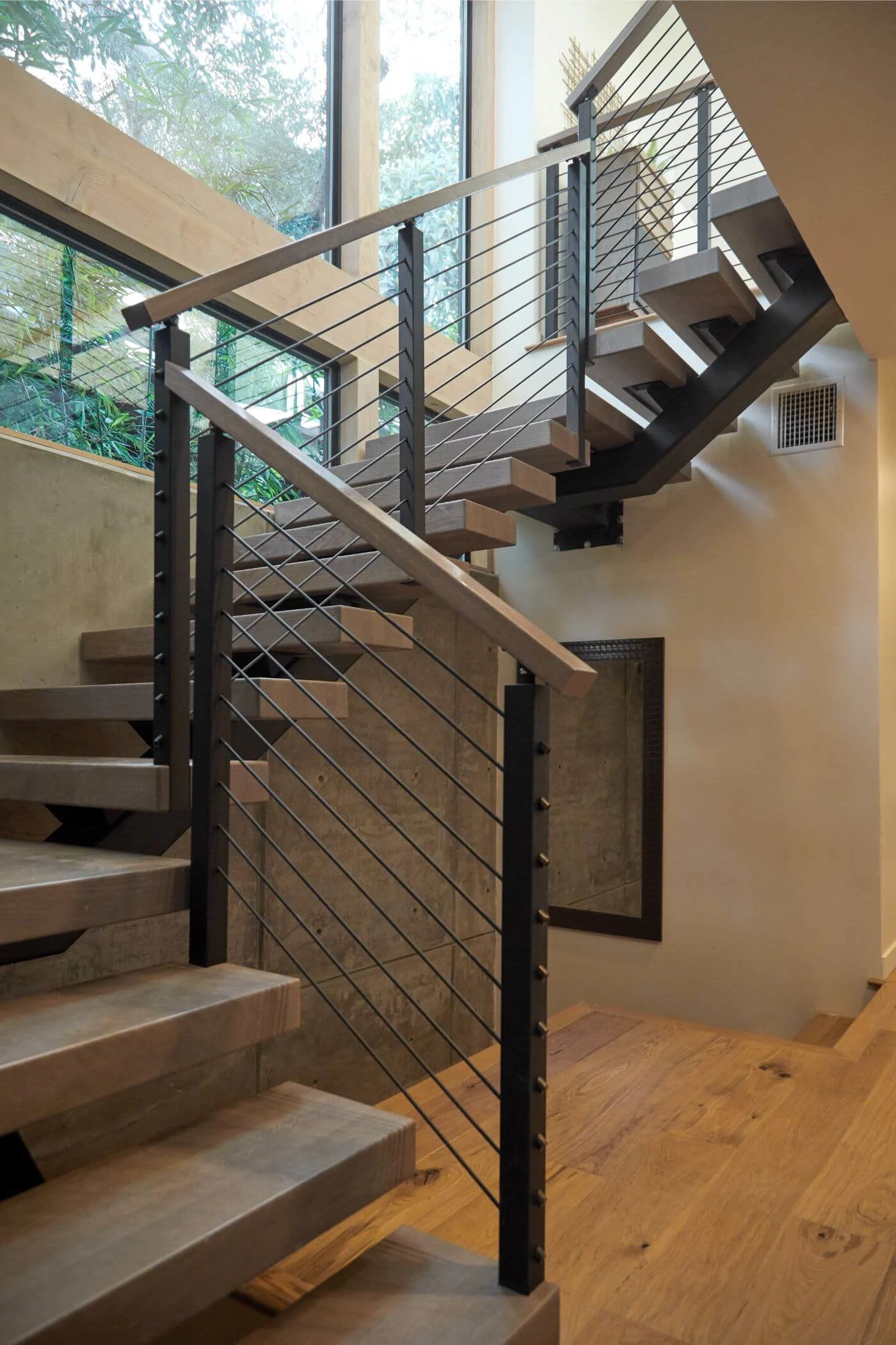 Stair turning at a landing with rod railing on both the flight and overlook