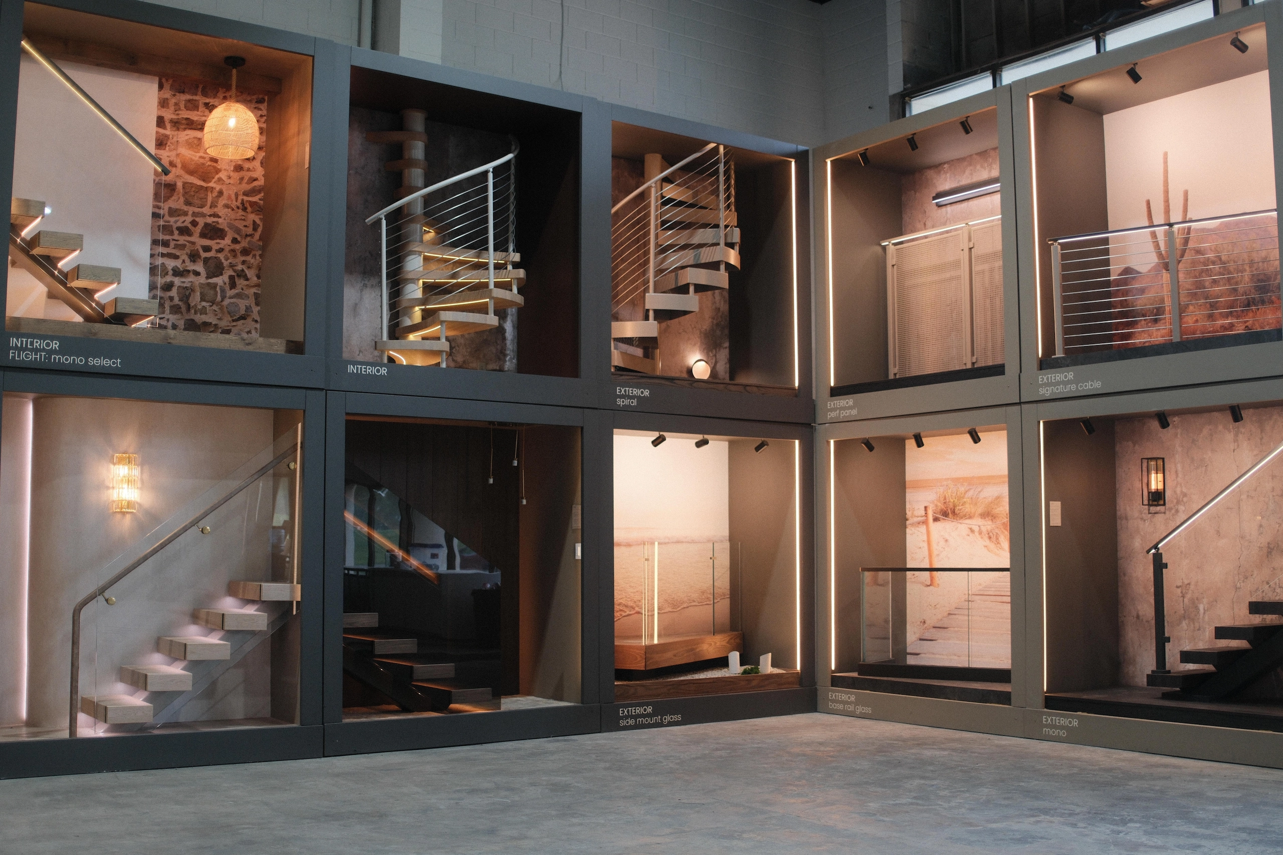 Lit display bays stack stair and railing setups across a showroom floor