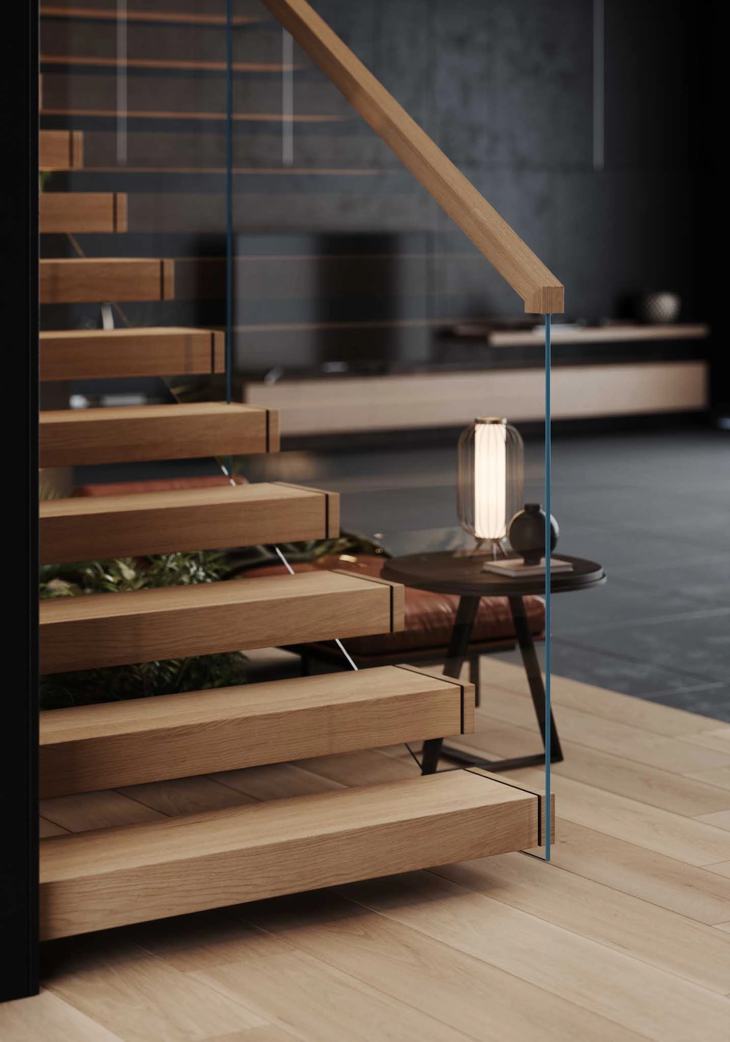 Close view of lower treads and glass railing beside a small side table