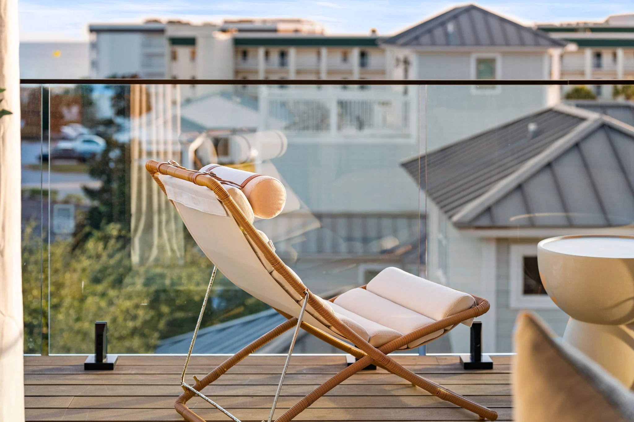 Spigots grip glass along a rooftop deck set with a folding sling chair