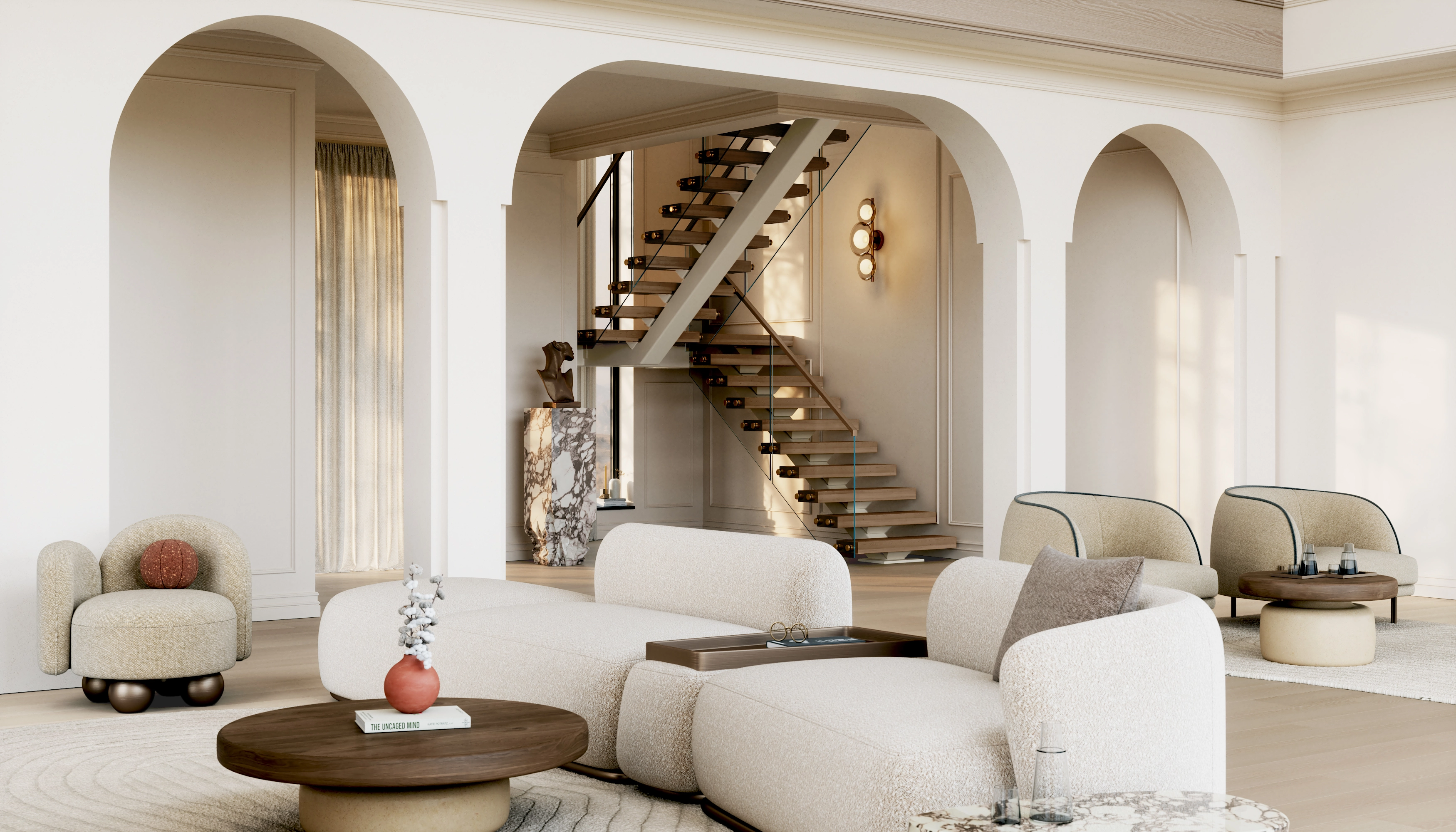 A glass railing traces a stair above a curved sofa in an arch-lined room