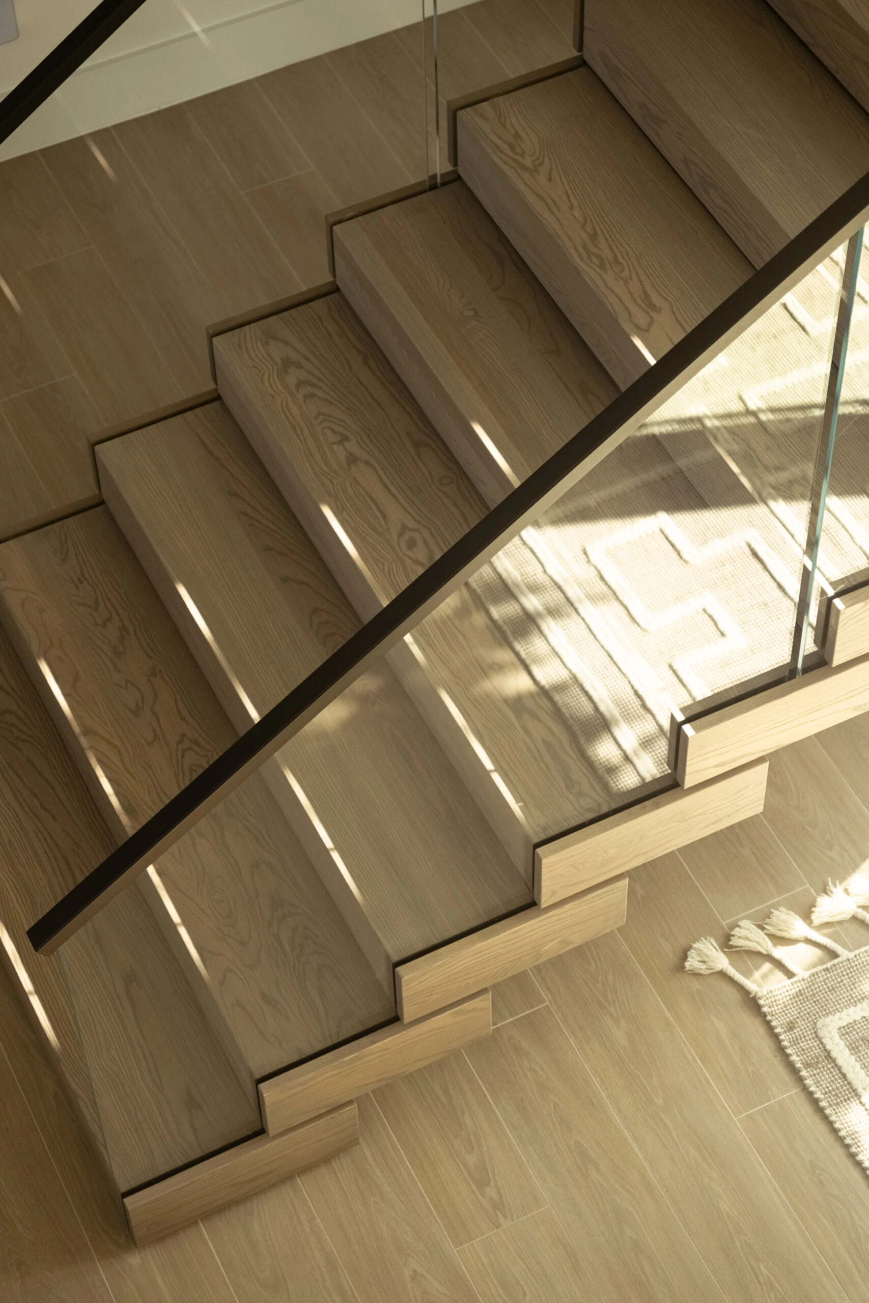 Sunlight falling across the treads seen from directly above the flight