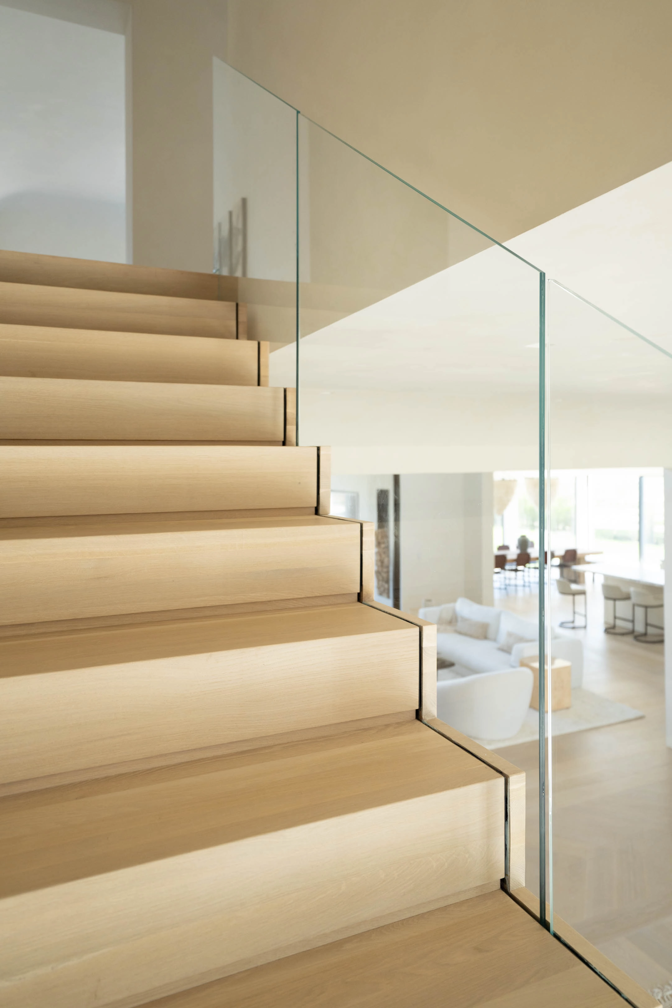 Treads seen from the base with the living room reflected in the glass
