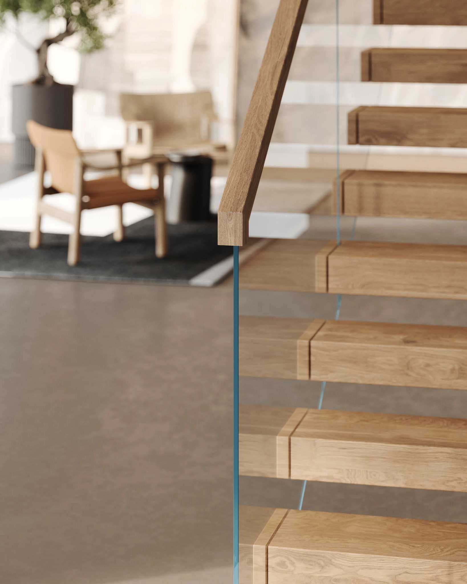 Glass panel edge in close focus with cantilevered treads and seating behind