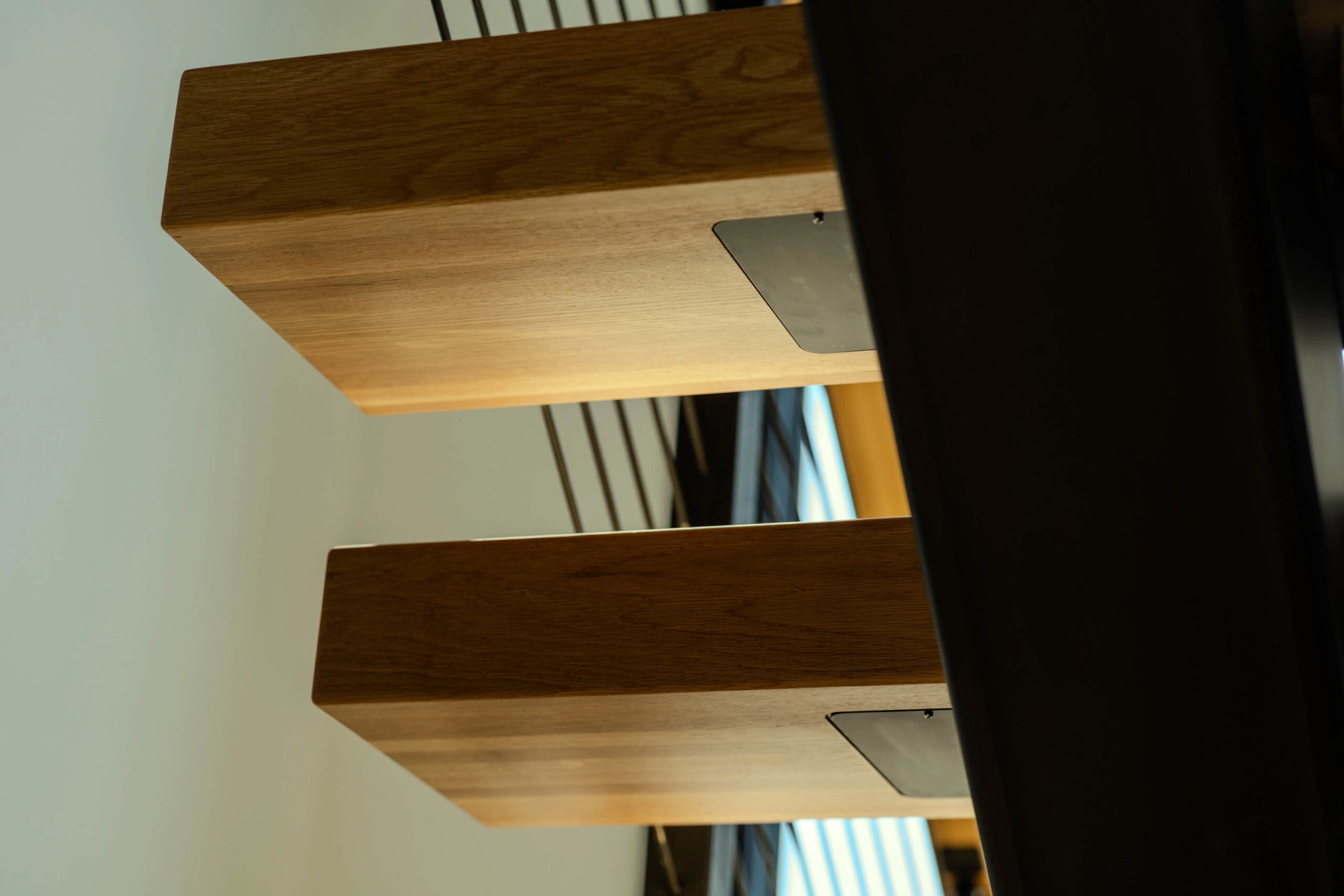 Detail of two treads lit from beneath with warm strip lighting