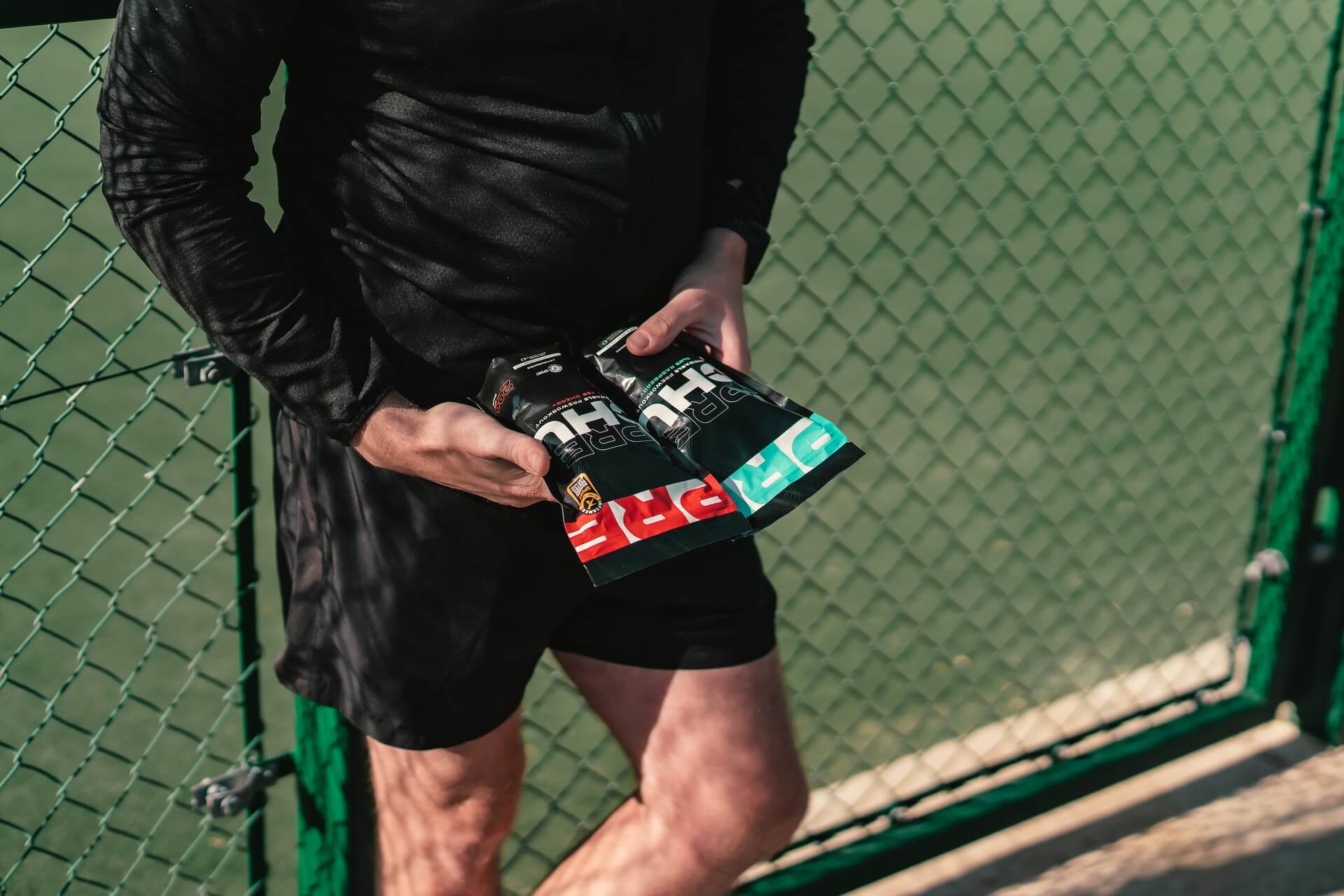 Man holding pre-workout mix