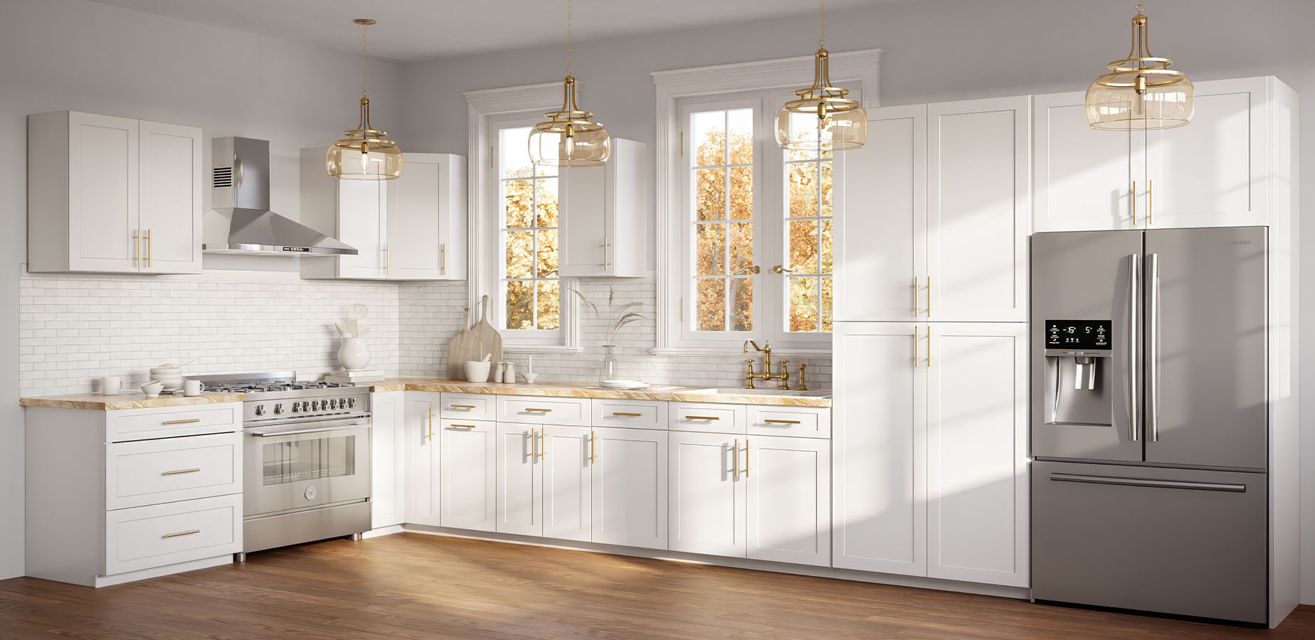 Bright modern kitchen with white cabinetry, marble countertops, stainless steel appliances, and pendant lights.